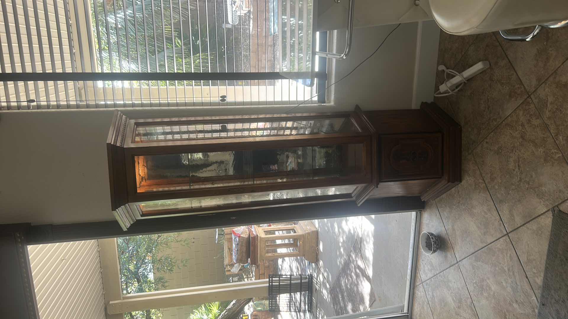 Photo 1 of VINTAGE ILIGHTED WOOD CURIO CABINET WITH WAVY GLASS 25” x 11” x H70”