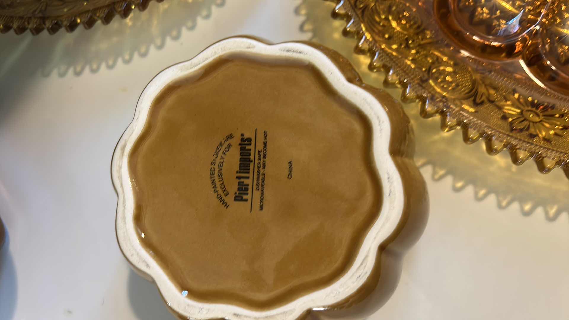 Photo 1 of AMBER GlASS PLATES, CERAMIC PUMPKINS AND DEEP BROWN/ AMBER CERAMIC PLATTER