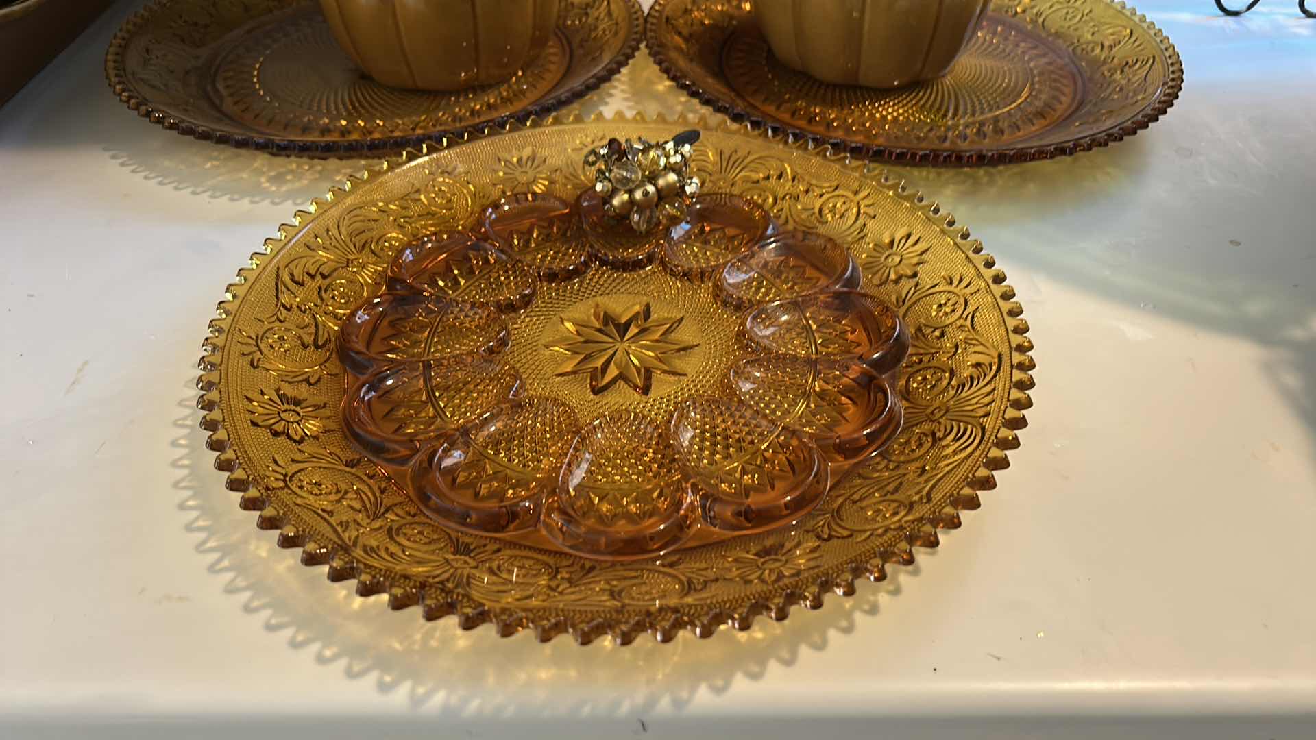 Photo 1 of AMBER GlASS PLATES, CERAMIC PUMPKINS AND DEEP BROWN/ AMBER CERAMIC PLATTER