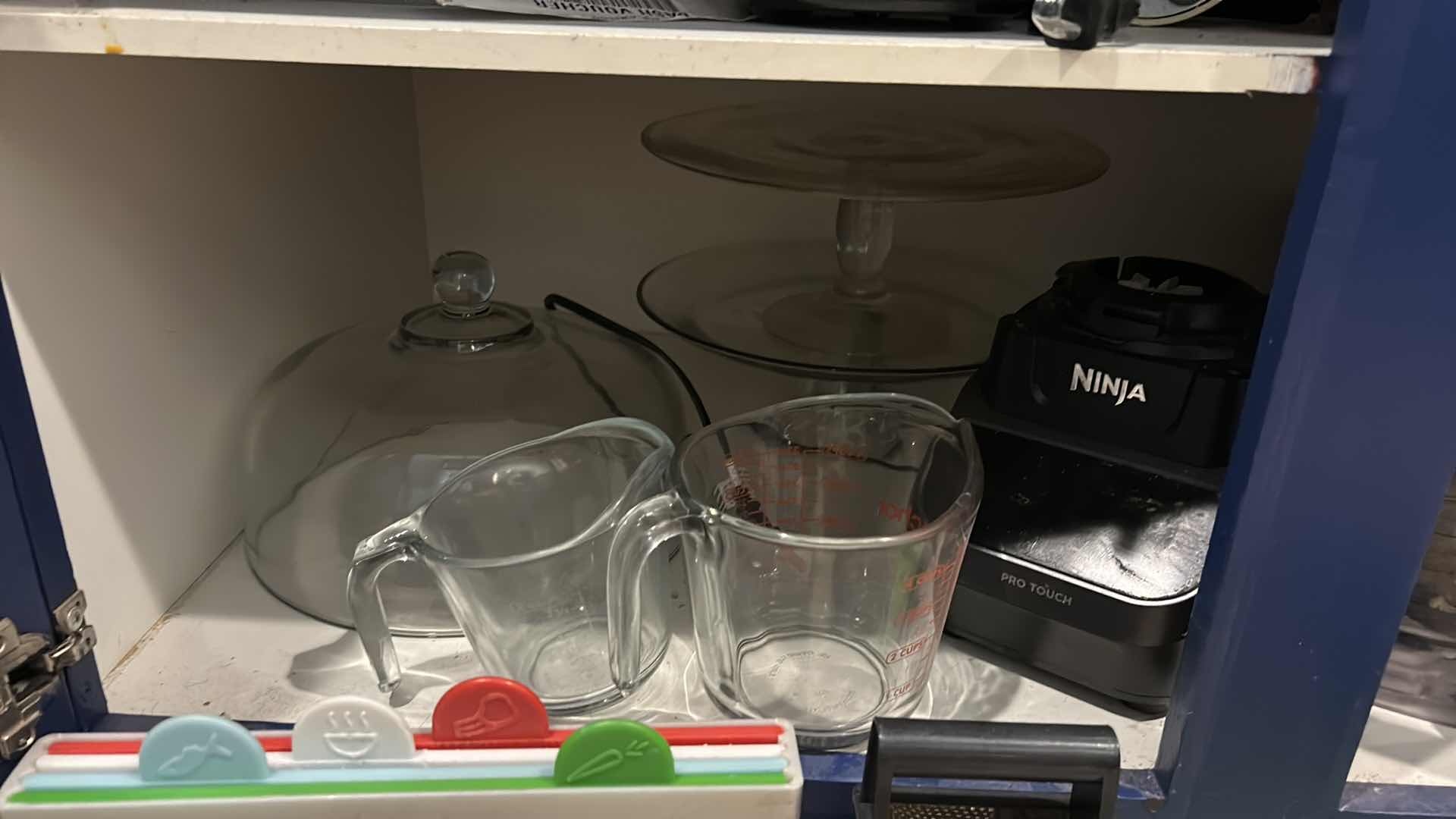 Photo 1 of CONTENTS OF CABINET IN KITCHEN
