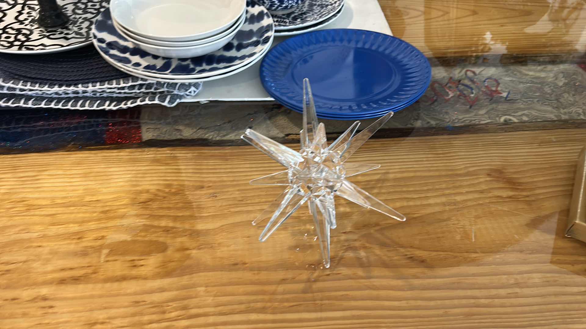 Photo 1 of PLACEMATS, BLUE AND WHITE PLATES, BOWLS AND ACRYLIC STAR