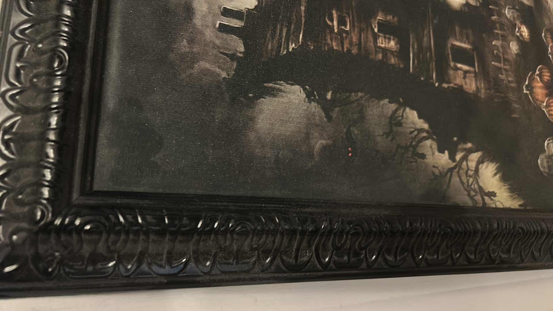 Photo 1 of BLACK WOOD FRAMED BATTERY OPERATED LIGHT UP HAUNTED HOUSE ARTWORK FOR HALLOWEEN AND MORE 
25” x 31”