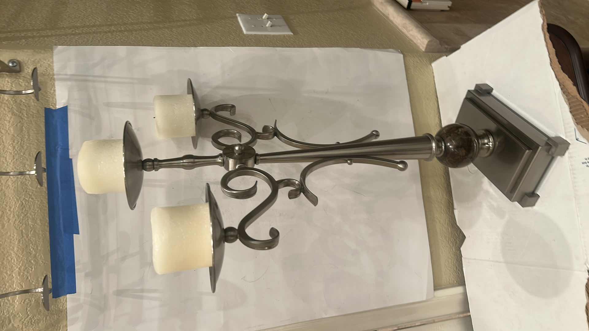 Photo 1 of - METAL THREE-ARM CANDELABRA, POSSIBLY WITH A PEWTER, SILVER, OR BRUSHED METAL FINISH. H26”