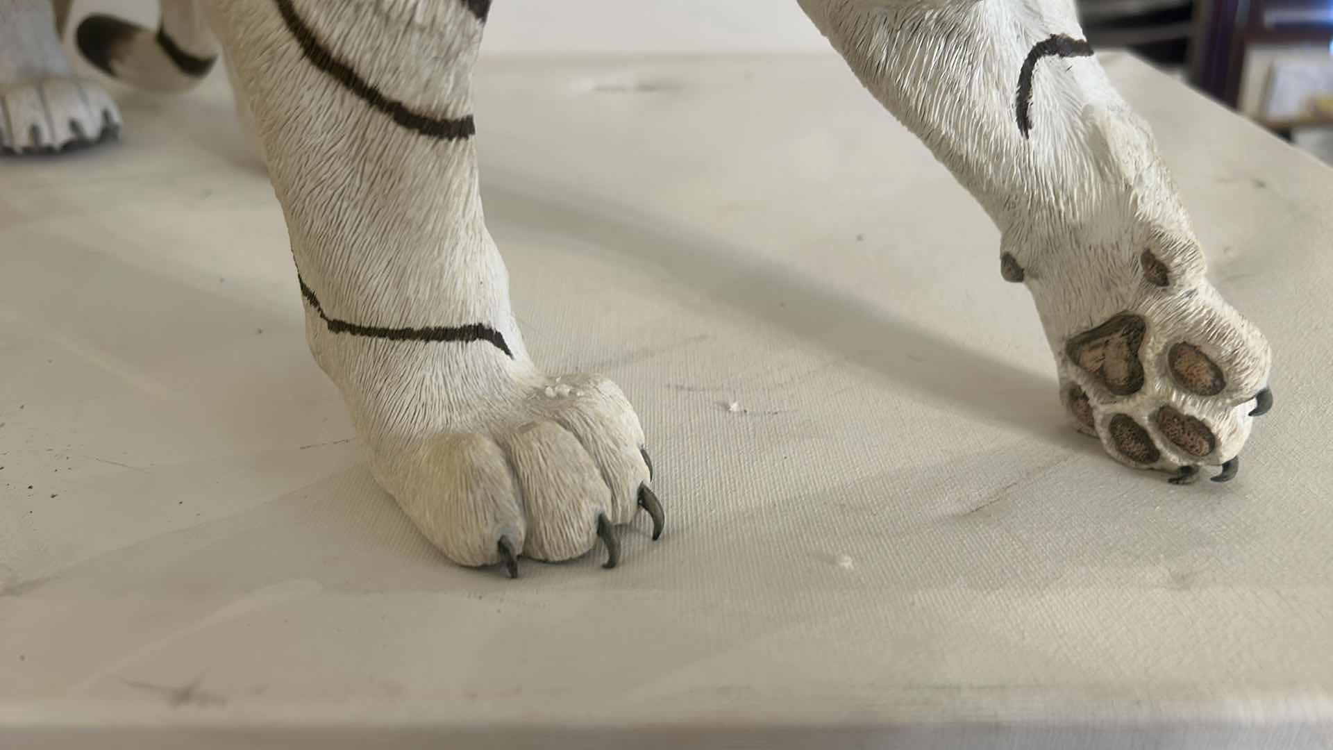 Photo 1 of RESIN WHITE TIGER FIGURINE, REALISTIC WILDLIFE SCULPTURE, HAND-PAINTED SAFARI DECOR, STATEMENT ANIMAL ACCENT PIECE. 20” x H10”