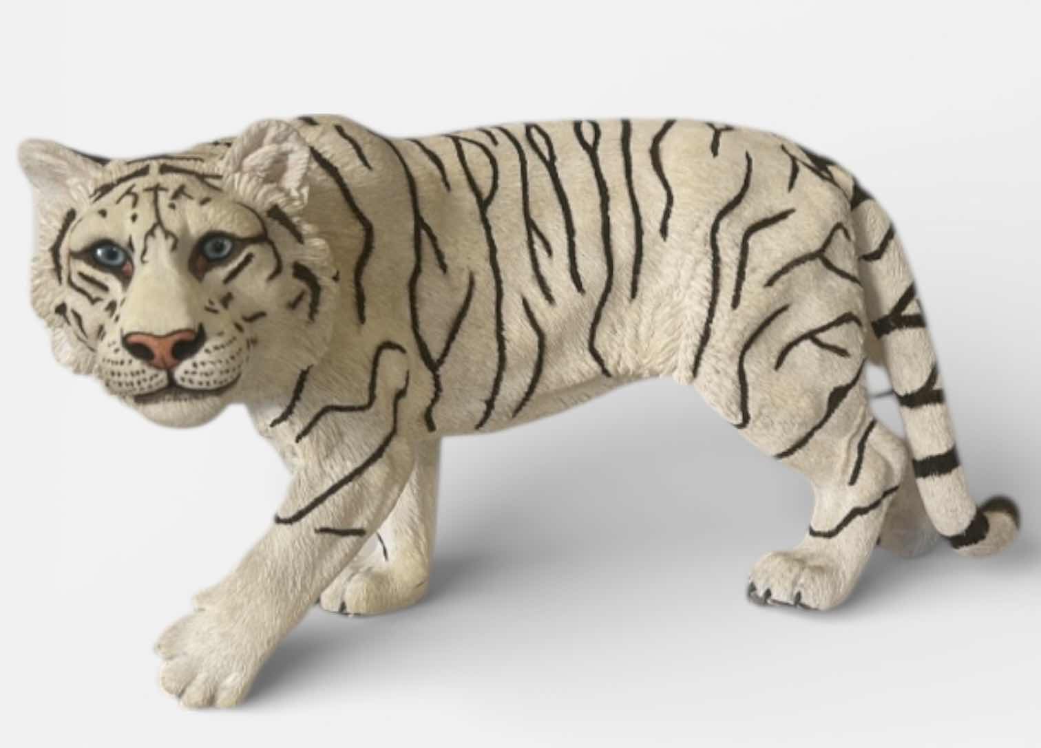 Photo 1 of RESIN WHITE TIGER FIGURINE, REALISTIC WILDLIFE SCULPTURE, HAND-PAINTED SAFARI DECOR, STATEMENT ANIMAL ACCENT PIECE. 20” x H10”
