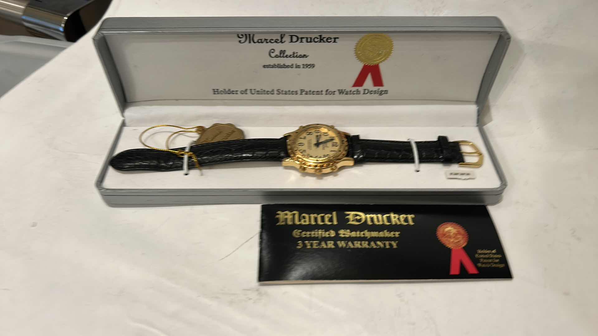 Photo 1 of MARCEL DRUCKER GOLD TONE TALKING WATCH FOR MEN LEATHER BAND