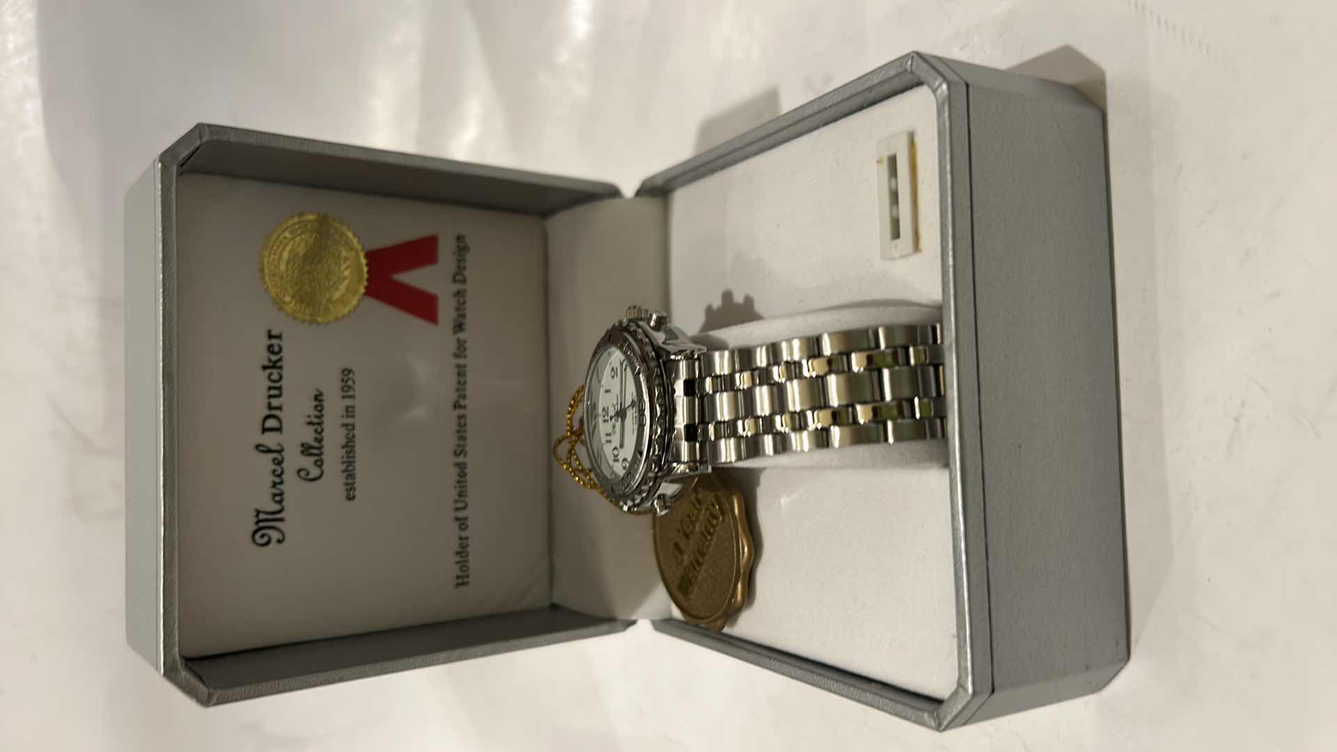 Photo 1 of MARCEL DRUCKER WOMEN’S SILVER 4-BUTTON BRACELET STYLE WATCH