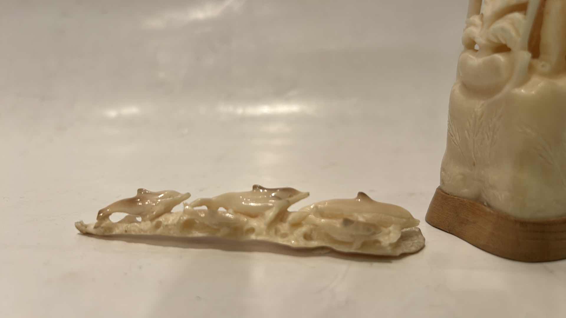 Photo 1 of 2 - IVORY OR BONE INTRICATELY HAND-CARVED AND PIERCED, DEPICTING FIGURES (POSSIBLY DEITIES OR MYTHICAL BEASTS) DOLPHINS AND NATURAL THEMES.
(TALLEST 5 1/2”)