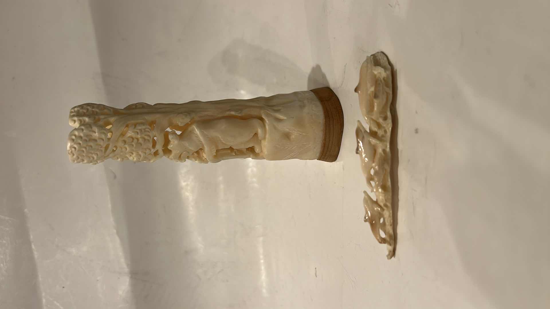 Photo 1 of 2 - IVORY OR BONE INTRICATELY HAND-CARVED AND PIERCED, DEPICTING FIGURES (POSSIBLY DEITIES OR MYTHICAL BEASTS) DOLPHINS AND NATURAL THEMES.
(TALLEST 5 1/2”)