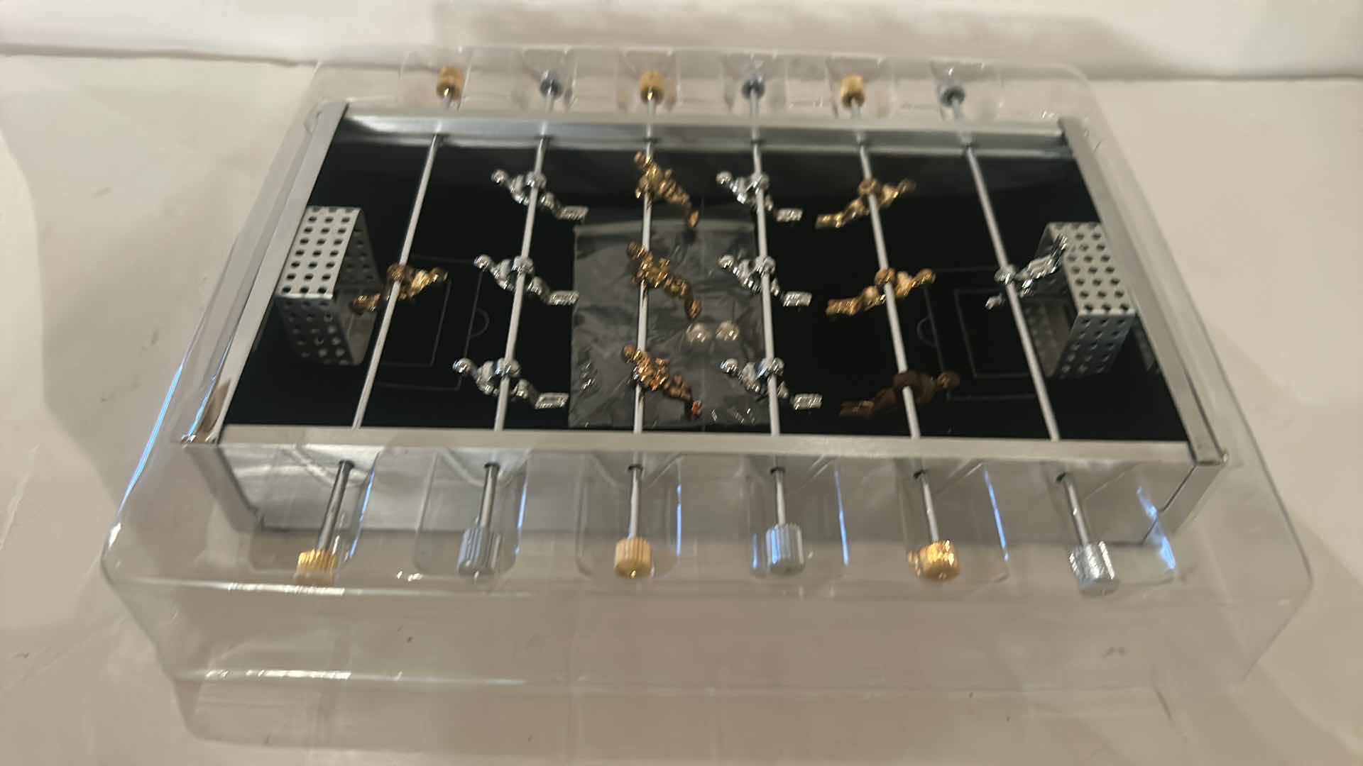 Photo 1 of MINIATURE CROSS FOOSBALL GAME 9” x 7 1/2”