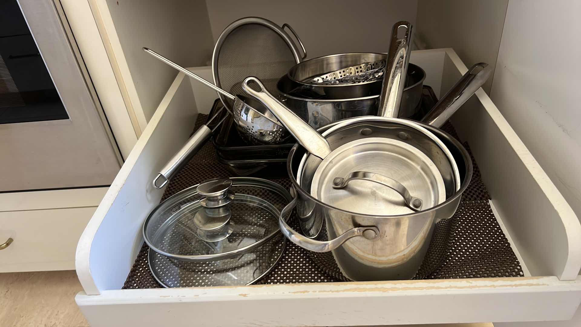 Photo 1 of CONTENTS OF 2 KITCHEN CABINETS-POTS & PANS, FOOD PROCESSOR, PASTA MATIC