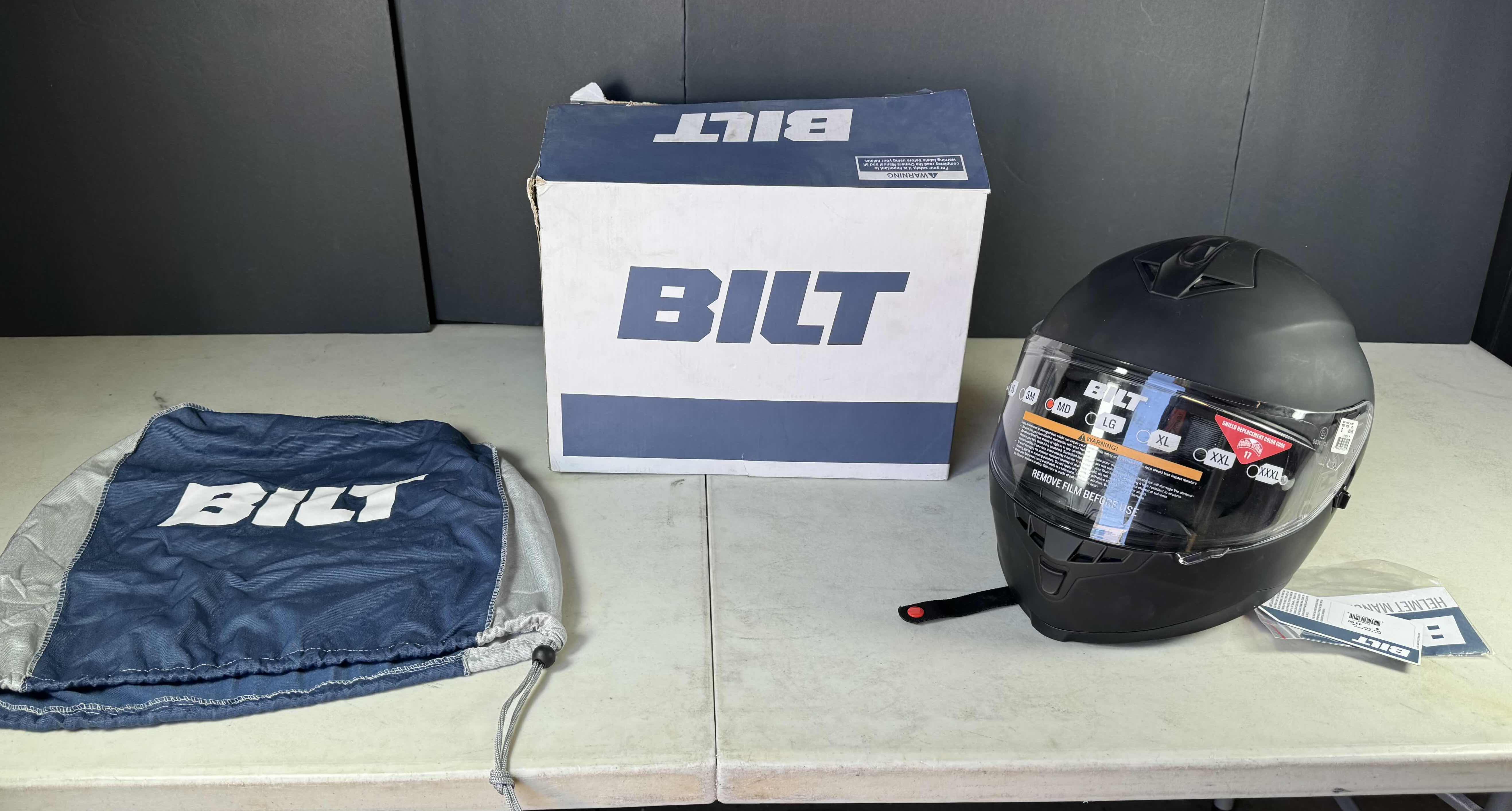 Photo 1 of BILT MATTE BLACK MOTORCYCLE HELMET WITH COVER SIZE MEDIUM
