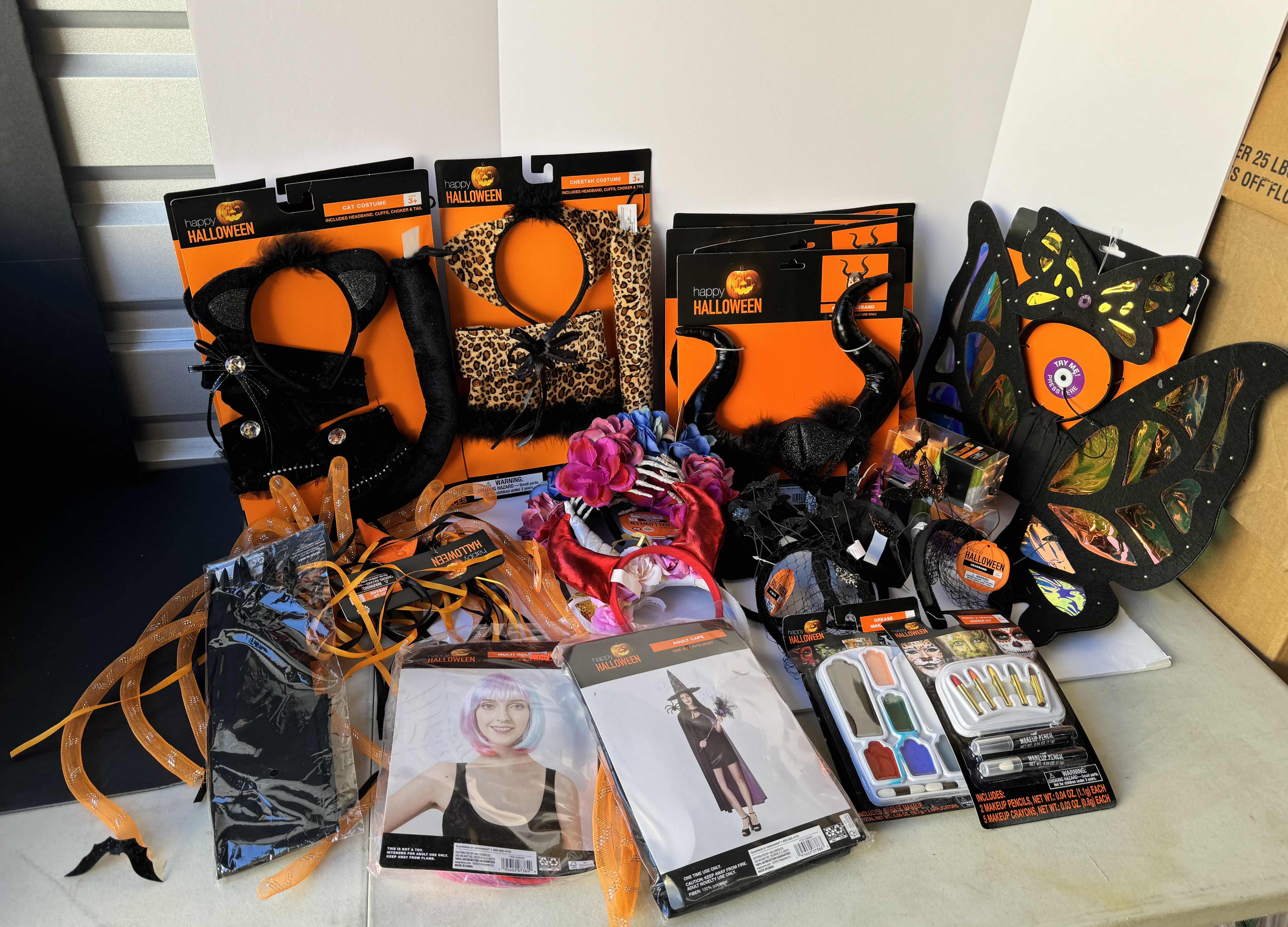 Photo 1 of HALLOWEEN COSTUMES, MASKS, WIGS, HEADBANDS, MAKE-UP AND MORE LARGE ASSORTED LOT - READY FOR HALLOWEEN