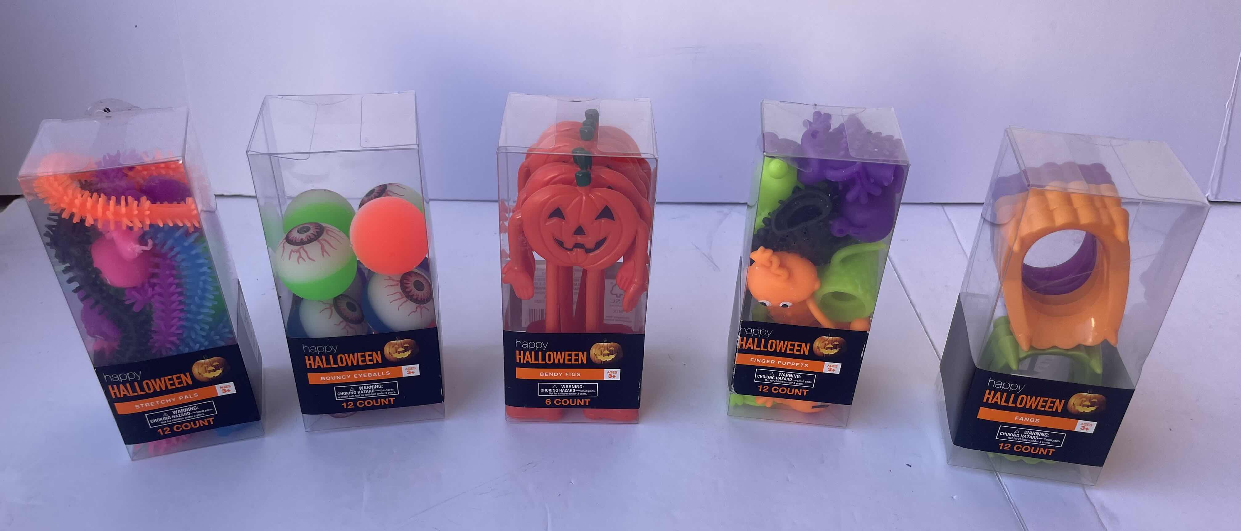 Photo 1 of HAPPY HALLOWEEN MINI TOYS ASSORTMENT- STRETCHY PALS TOY (1), BOUNCY EYEBALLS (1), FINGER PUPPETS (3), BENDY FIGS (16), FANGS (15) & CHARACTER SQUISH (16) - TOTAL 52 BOXES