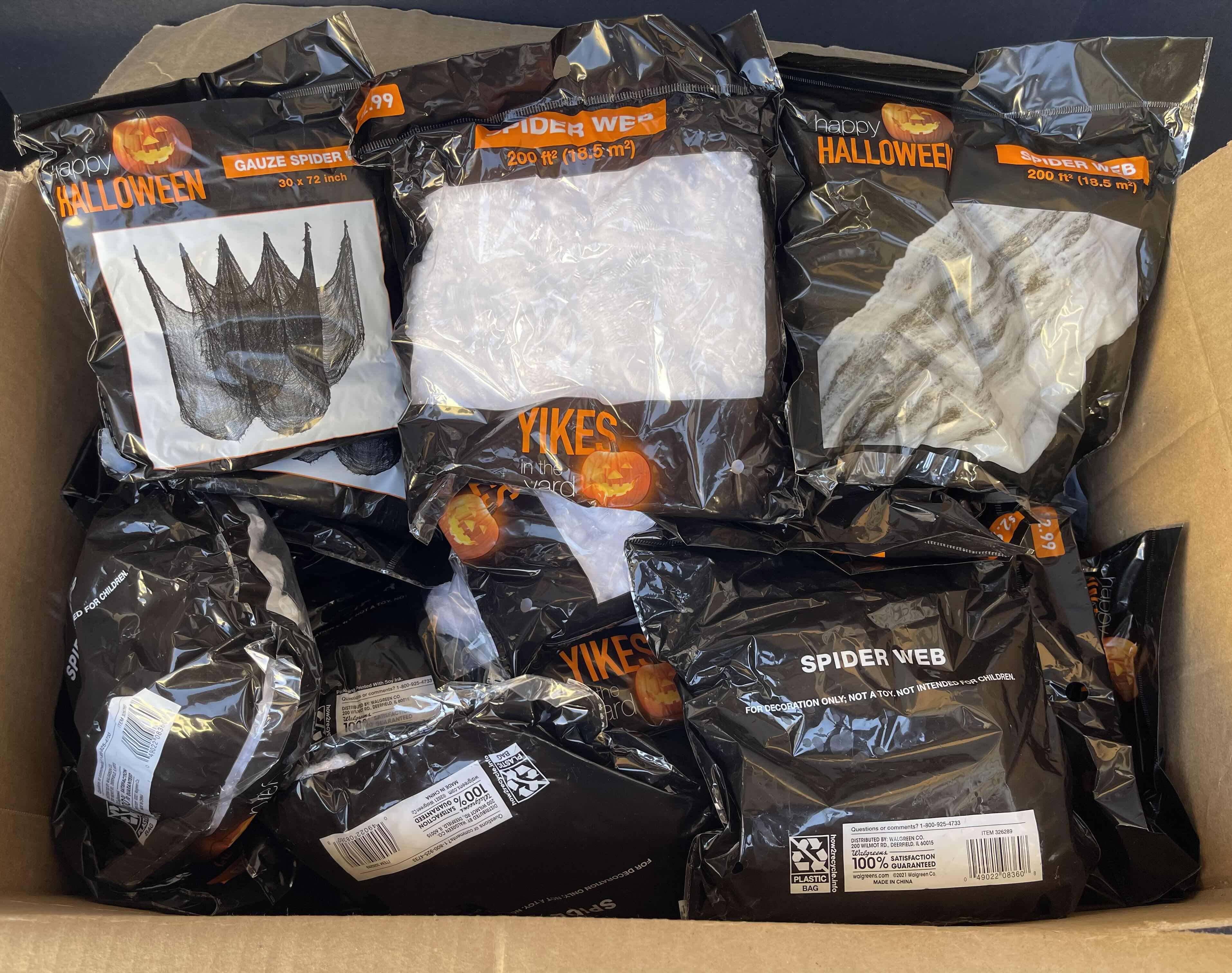 Photo 1 of BOX OF HAPPY HALLOWEEN SPIDER WEBS - SPIDER WEB BAGS (23), SPIDER WEB YIKES IN THE YARD (10) & GAUZE SPIDER WEB BAGS (2)