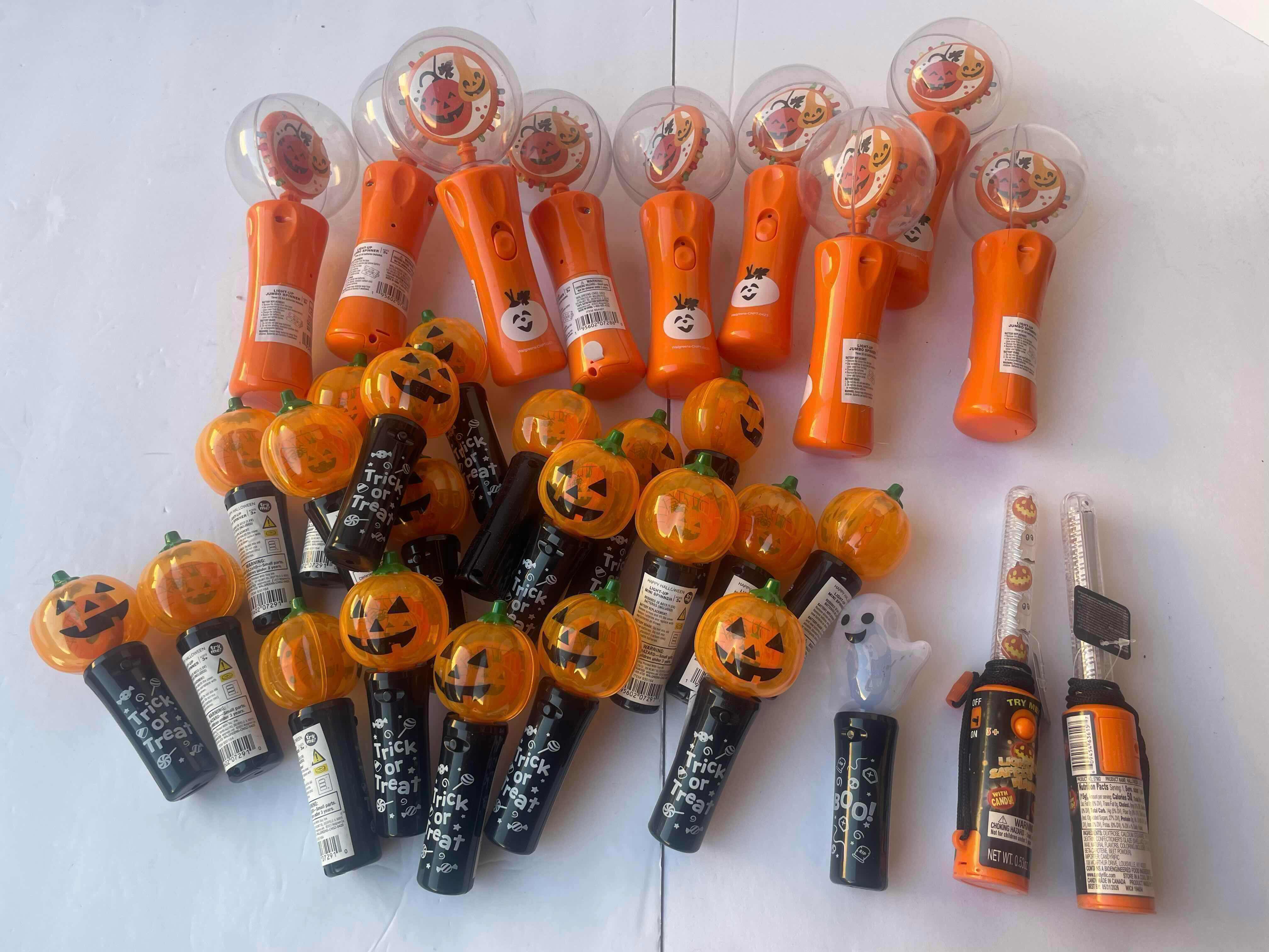 Photo 1 of HAPPY HALLOWEEN LIGHT UP SPINNERS/WANDS LOT (30 PIECES)