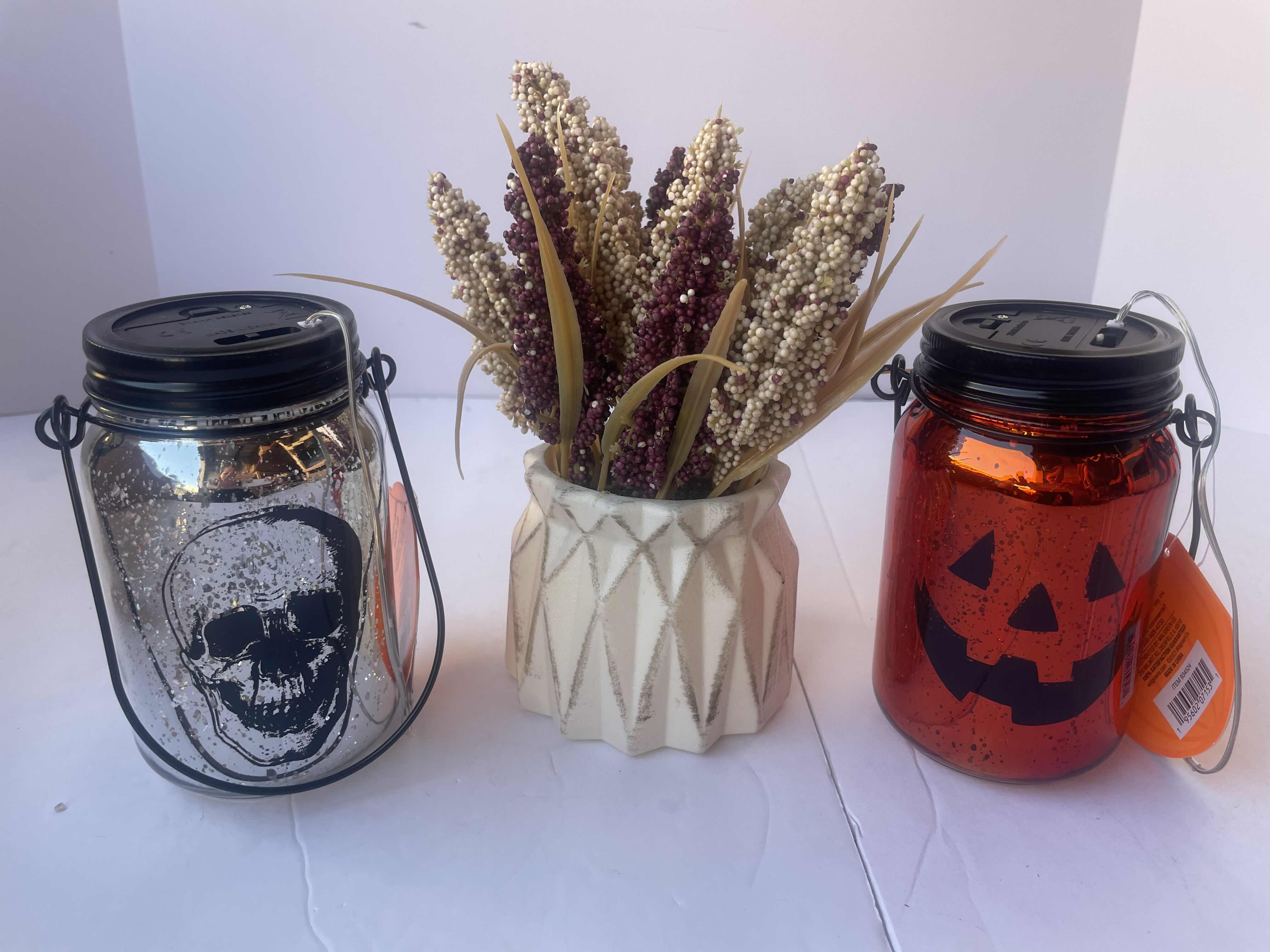 Photo 1 of NEW HAPPY HALLOWEEN HOME DECOR LARGE LOT - PUMPKIN LIGHT UP GLASS LANTERN (6), SKELETON LIGHT UP GLASS LANTERN (10) & FOAM POT PLASTIC FLOWER FALL DECOR (7) - TOTAL 23 PIECES
