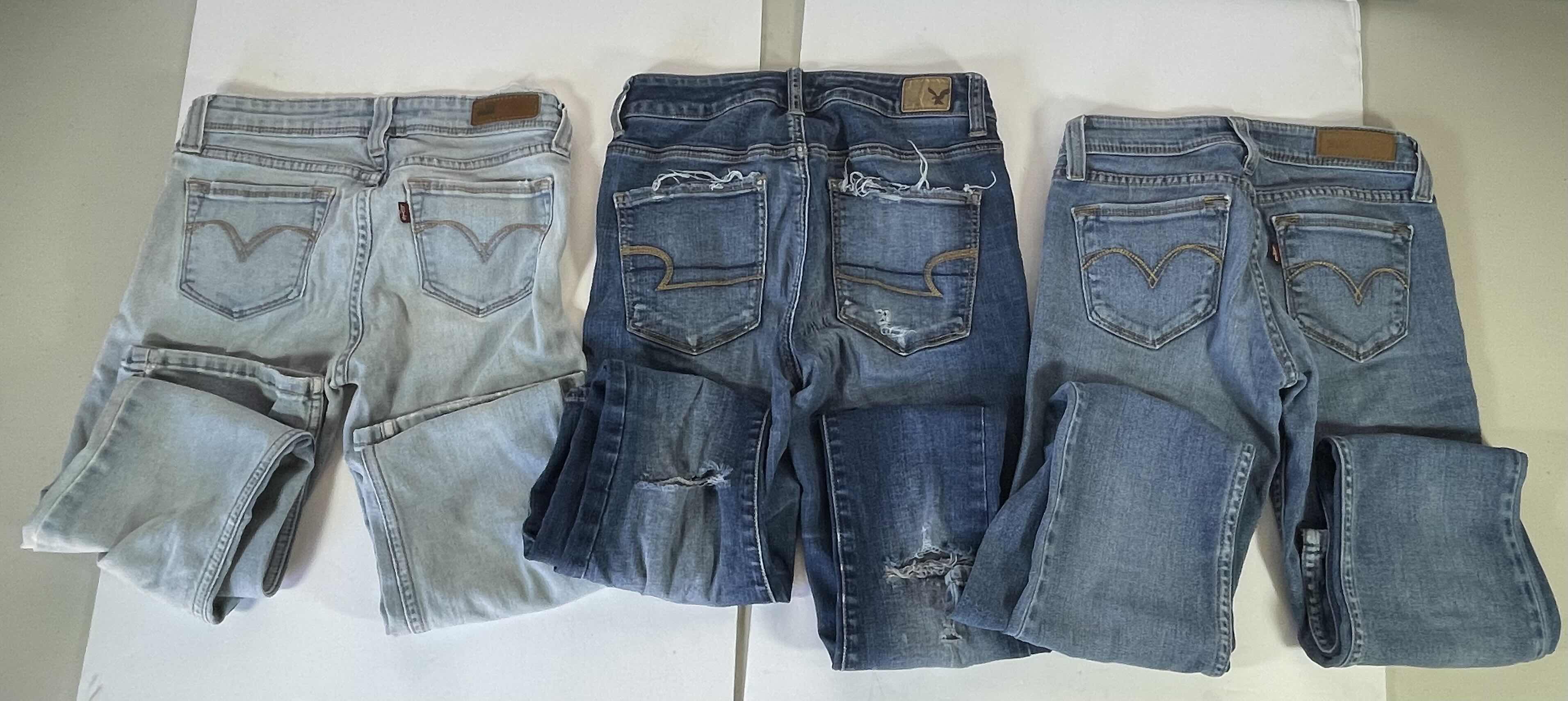 Photo 5 of WOMENS BLUE JEANS (3) SIZES 26 & 4