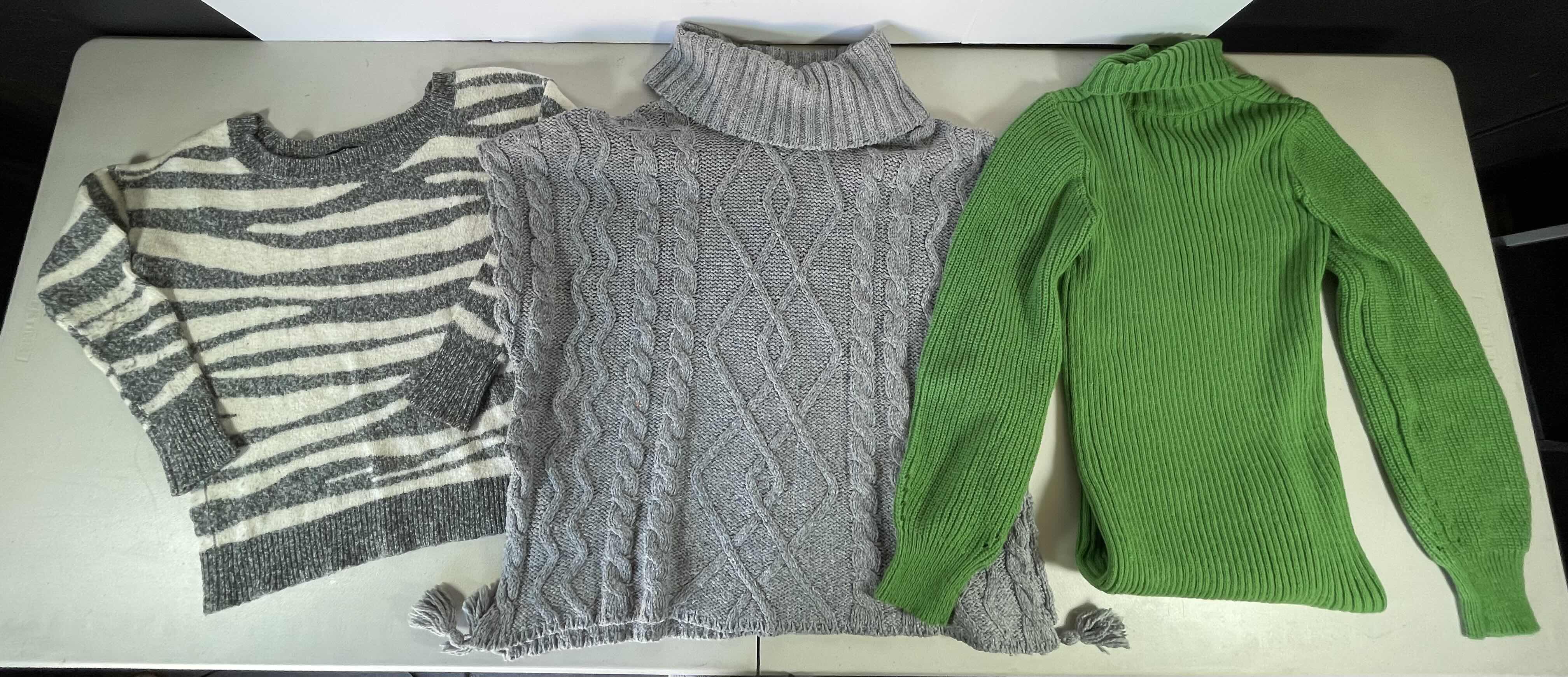 Photo 1 of WOMENS LONG SLEEVE SWEATERS (2) & NO SLEEVE SWEATER SIZE S/M