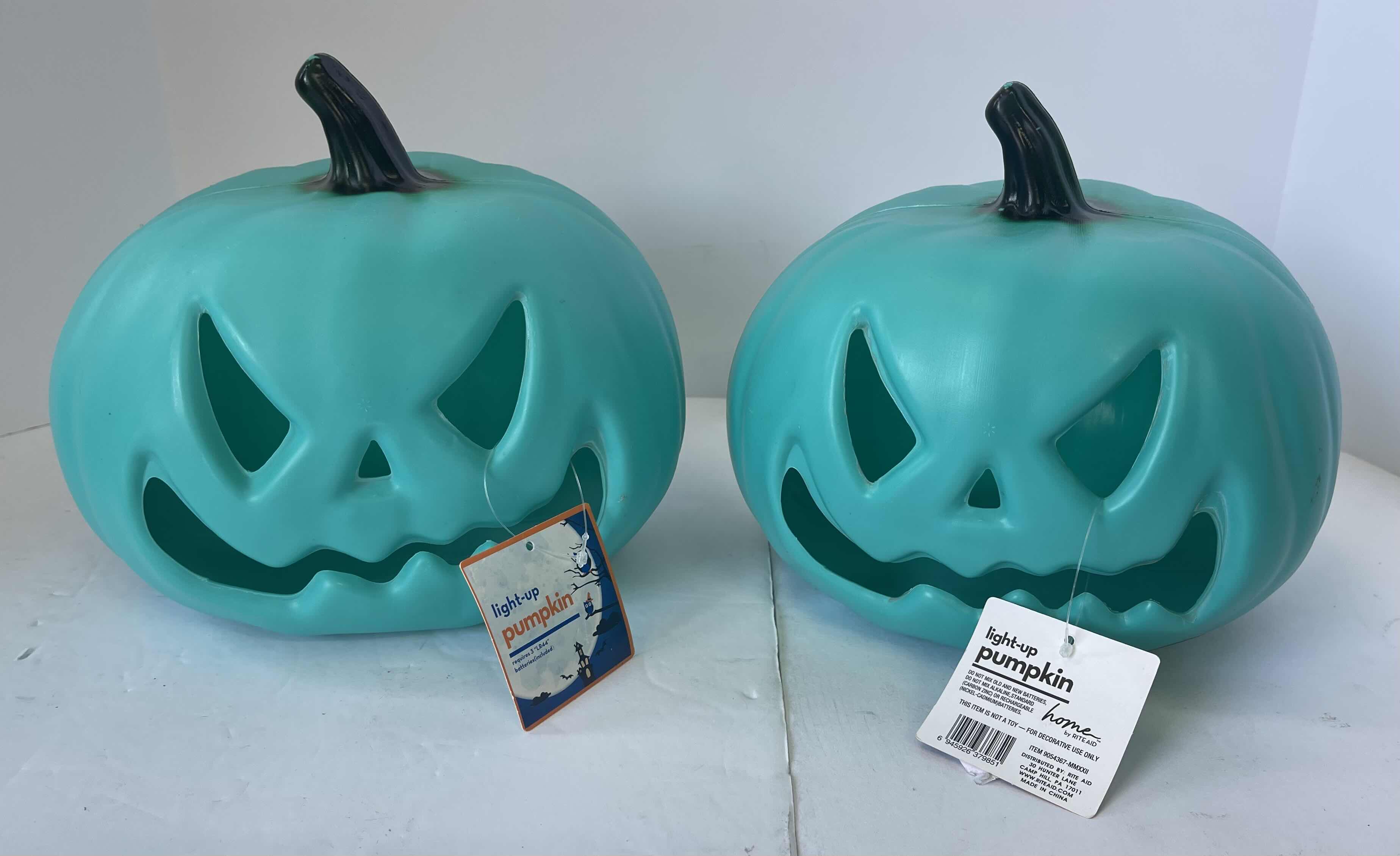 Photo 1 of GREEN PLASTIC LED LIGHT UP PUMPKINS (2) H7.5” NEW