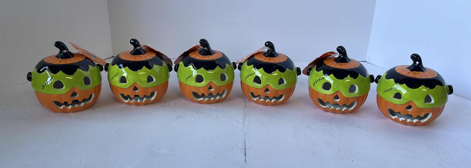 Photo 1 of HAPPY HALLOWEEN 4” MINI CERAMIC LIGHT UP PUMPKINS (6)