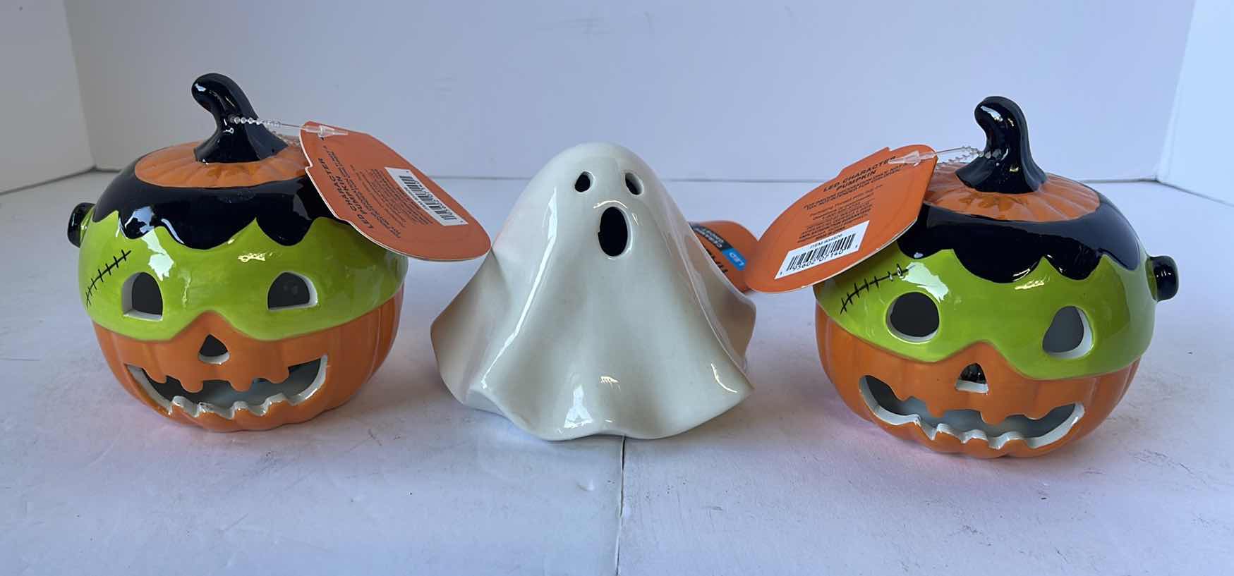 Photo 1 of HAPPY HALLOWEEN 4” MINI CERAMIC LIGHT UP PUMPKINS (2) & CERAMIC GHOST