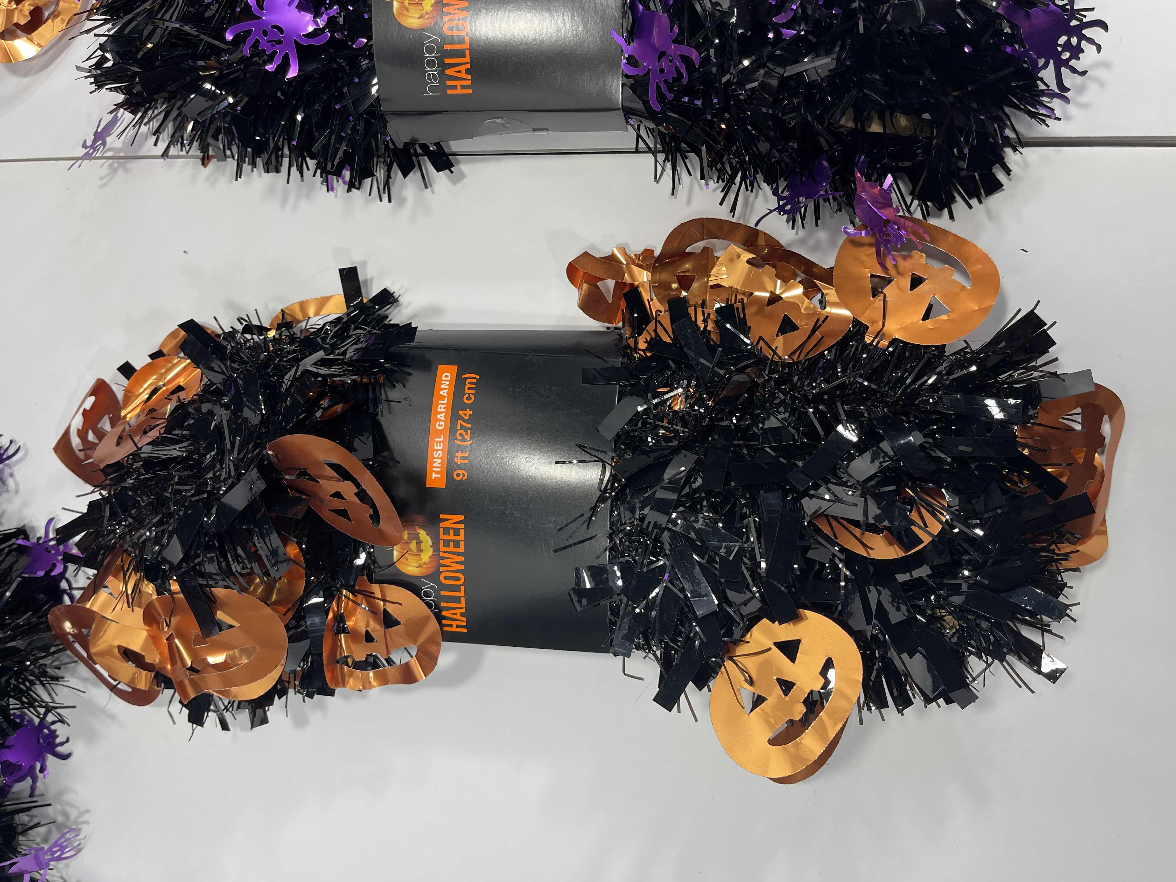 Photo 3 of HALLOWEEN TINSEL GARLAND - BLACK WITH PURPLE SPIDERS 9’ (5) & BLACK WITH ORANGE PUMPKINS 9’ (5) MSRP $80