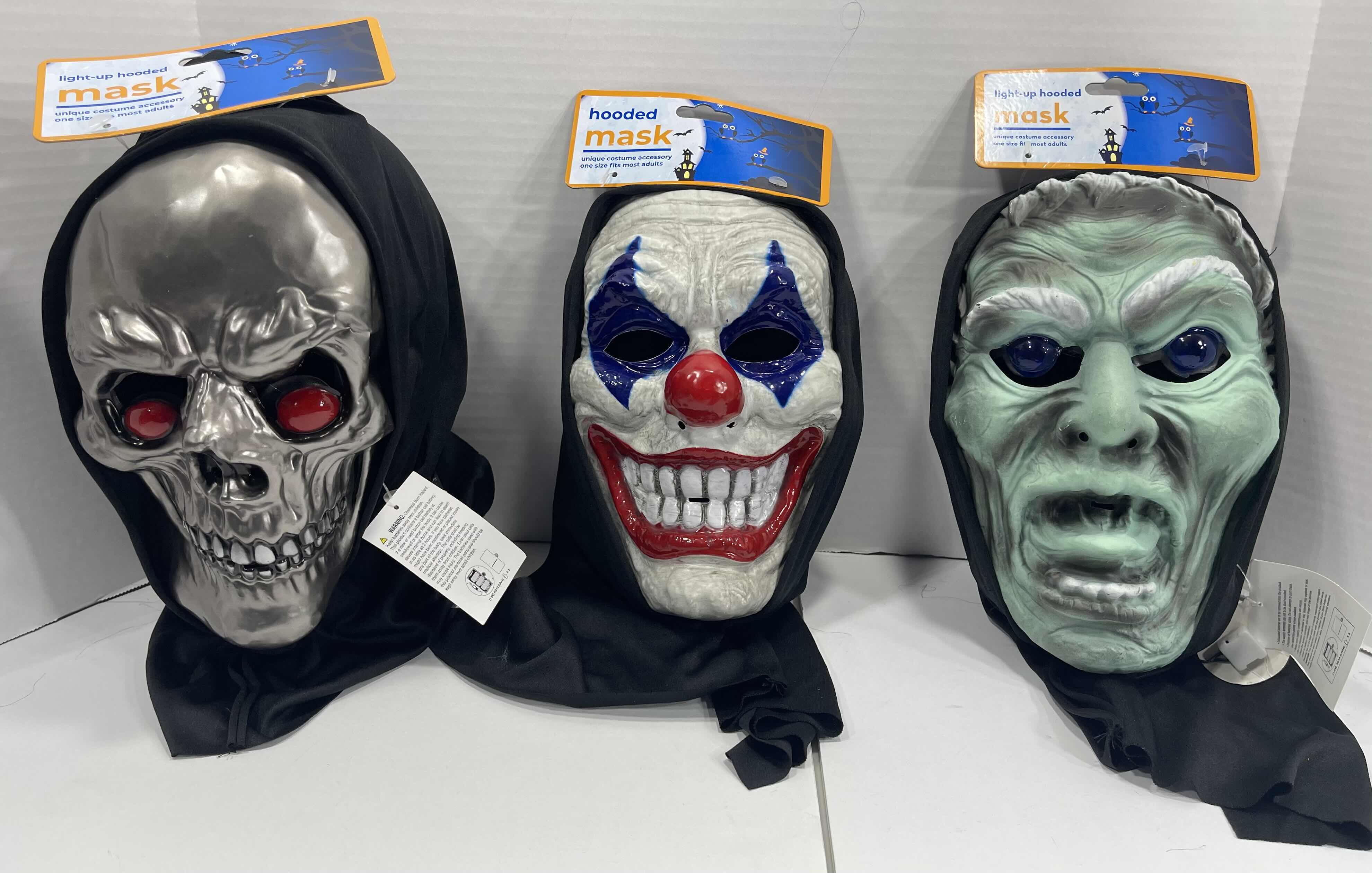 Photo 1 of ADULT ONE SIZE FITS MOST HALLOWEEN PLASTIC HOODED MASKS (3) - TWO MASKS WITH LIGHT UP EYES MSRP $60