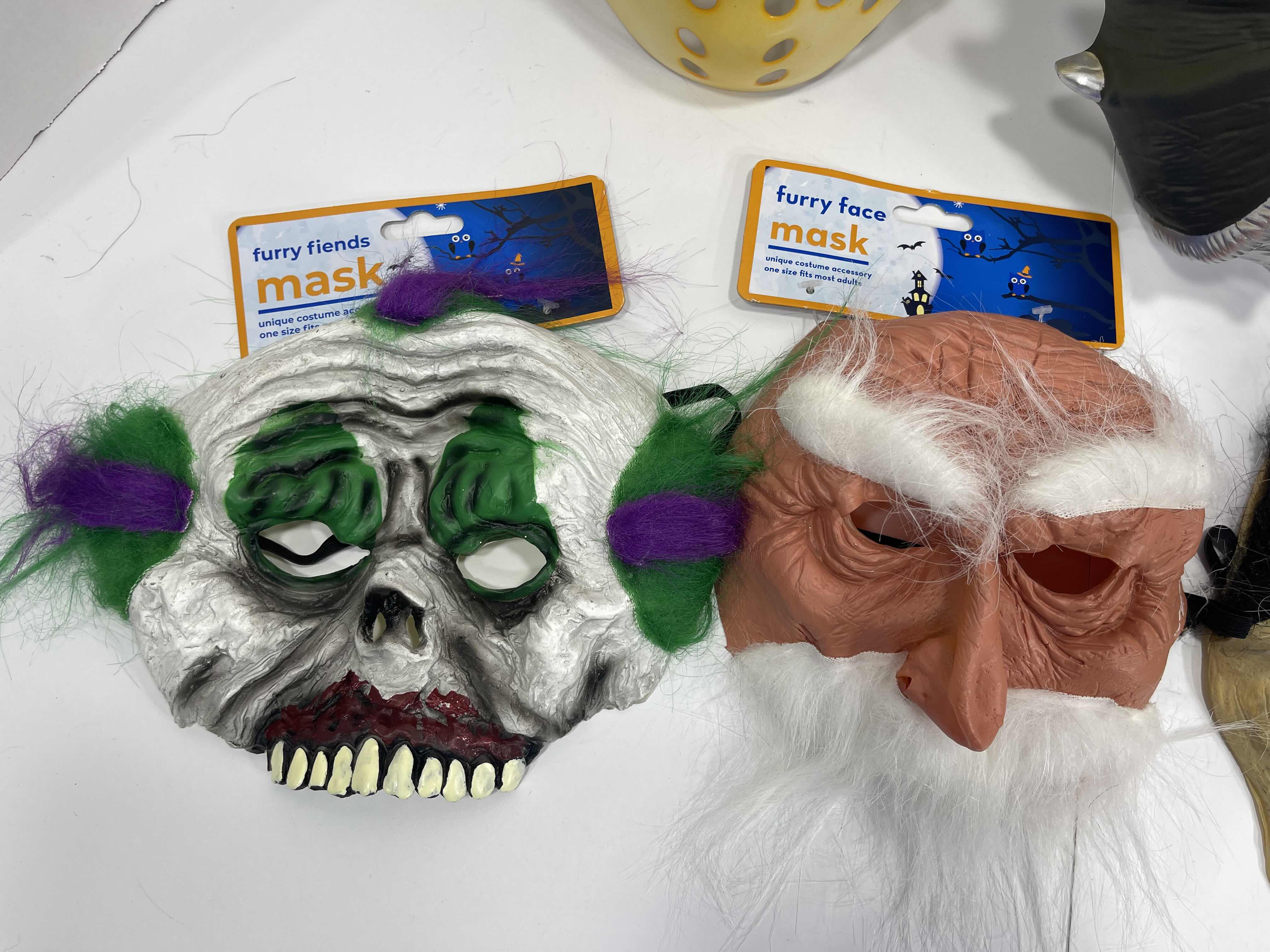 Photo 2 of ADULT ONE SIZE FITS MOST HALLOWEEN PLASTIC MASKS (2)  & FURRY FRIENDS RUBBER MASKS (3) MSRP $45