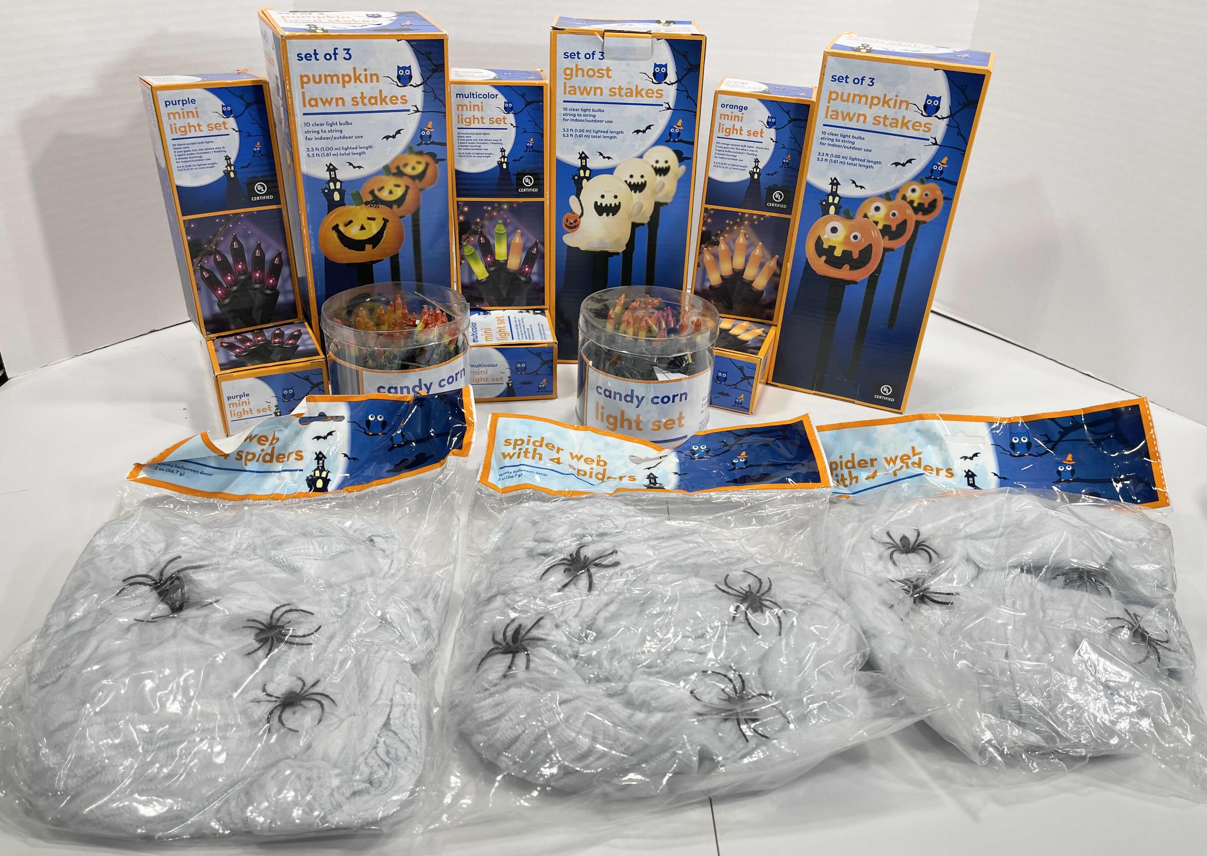 Photo 1 of HALLOWEEN INDOOR/OUTDOOR LIGHT SETS (6), CANDY CORN LIGHT SET (2), LIGHTED LAWN STAKES (3) & SPIDER WEBS WITH SPIDERS (3 BAGS) MSRP $75