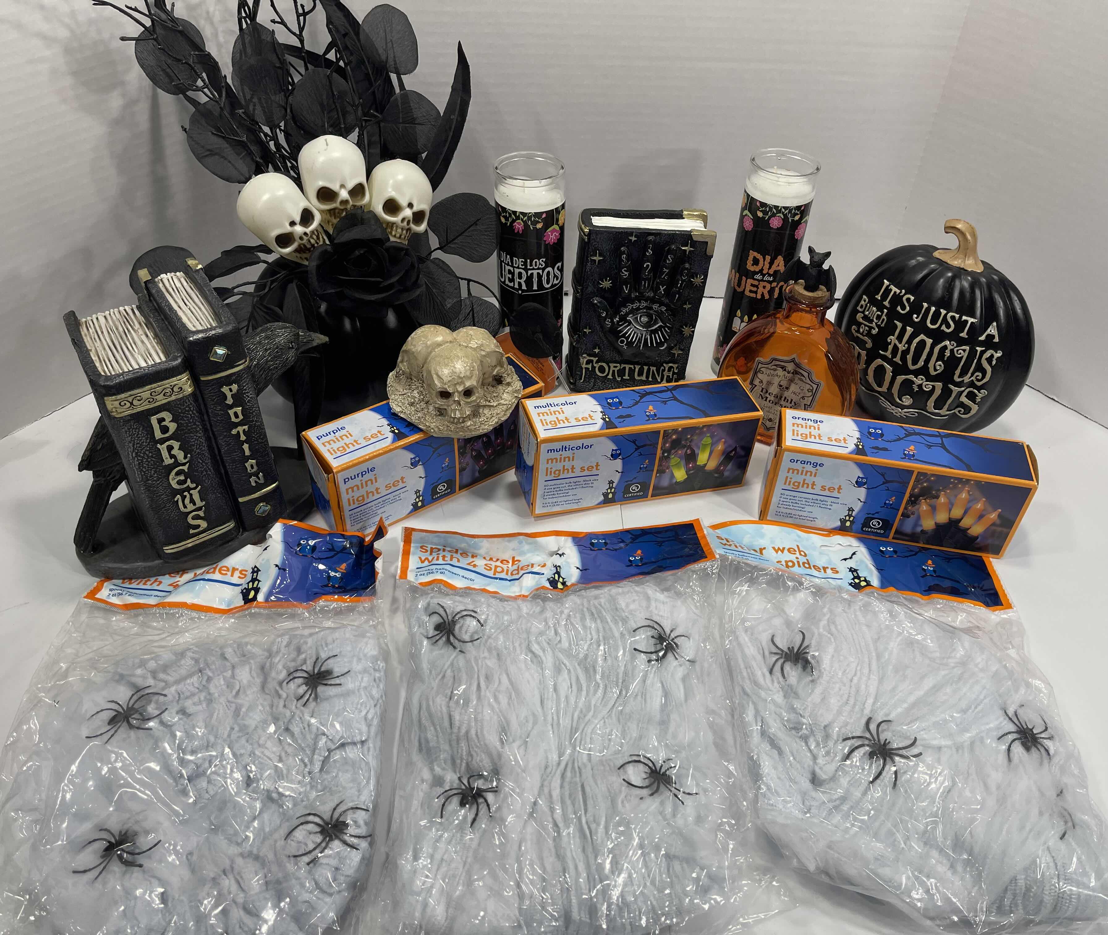 Photo 1 of HALLOWEEN HOME TABLE TOP DECOR (14 ITEMS) -  SPIDER WEBS, LIGHT SETS, CANDLES, RESIN DECOR ETC MSRP $100