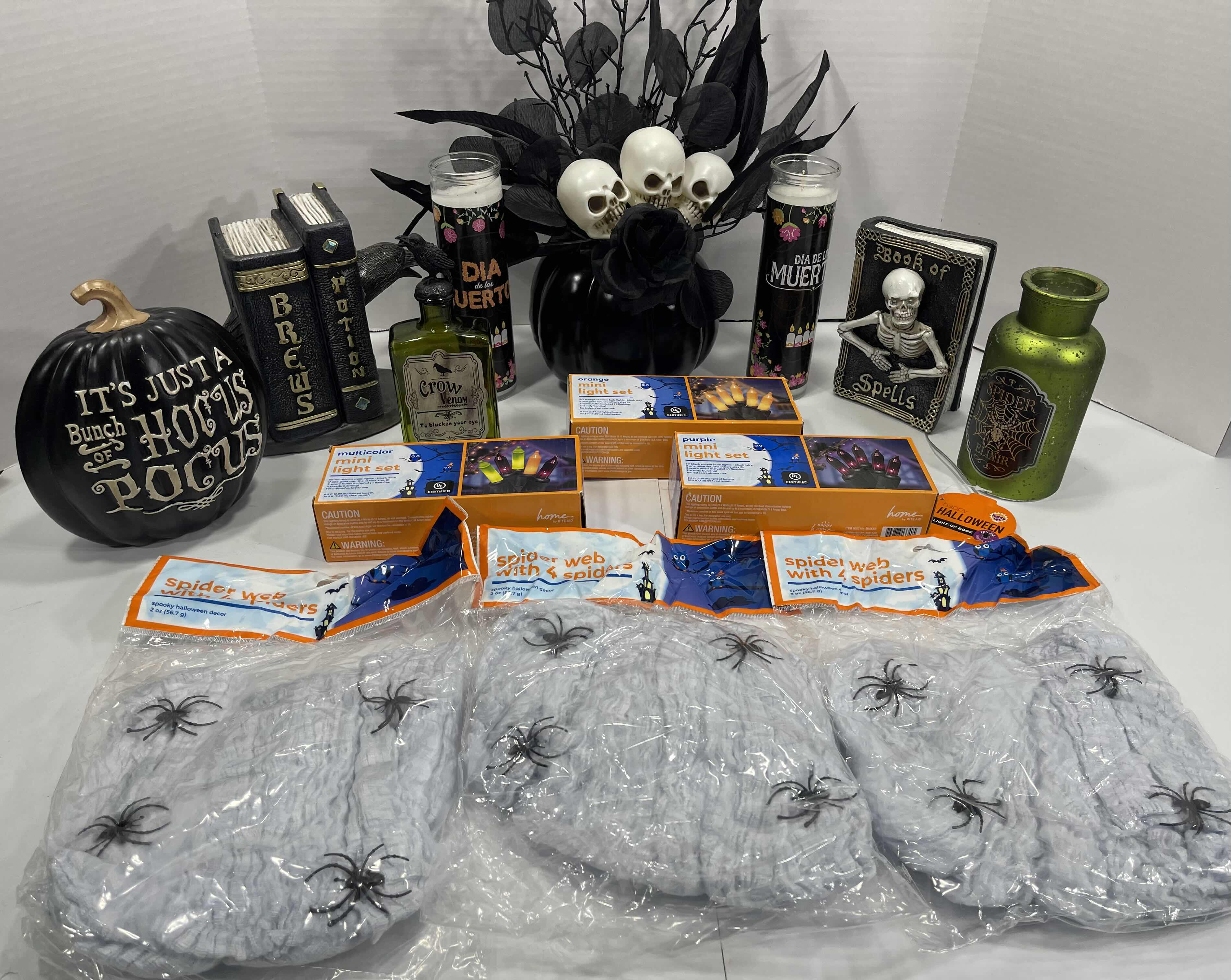 Photo 1 of HALLOWEEN HOME TABLE TOP DECOR (14 ITEMS) -  SPIDER WEBS, LIGHT SETS, CANDLES, RESIN DECOR ETC MSRP $100