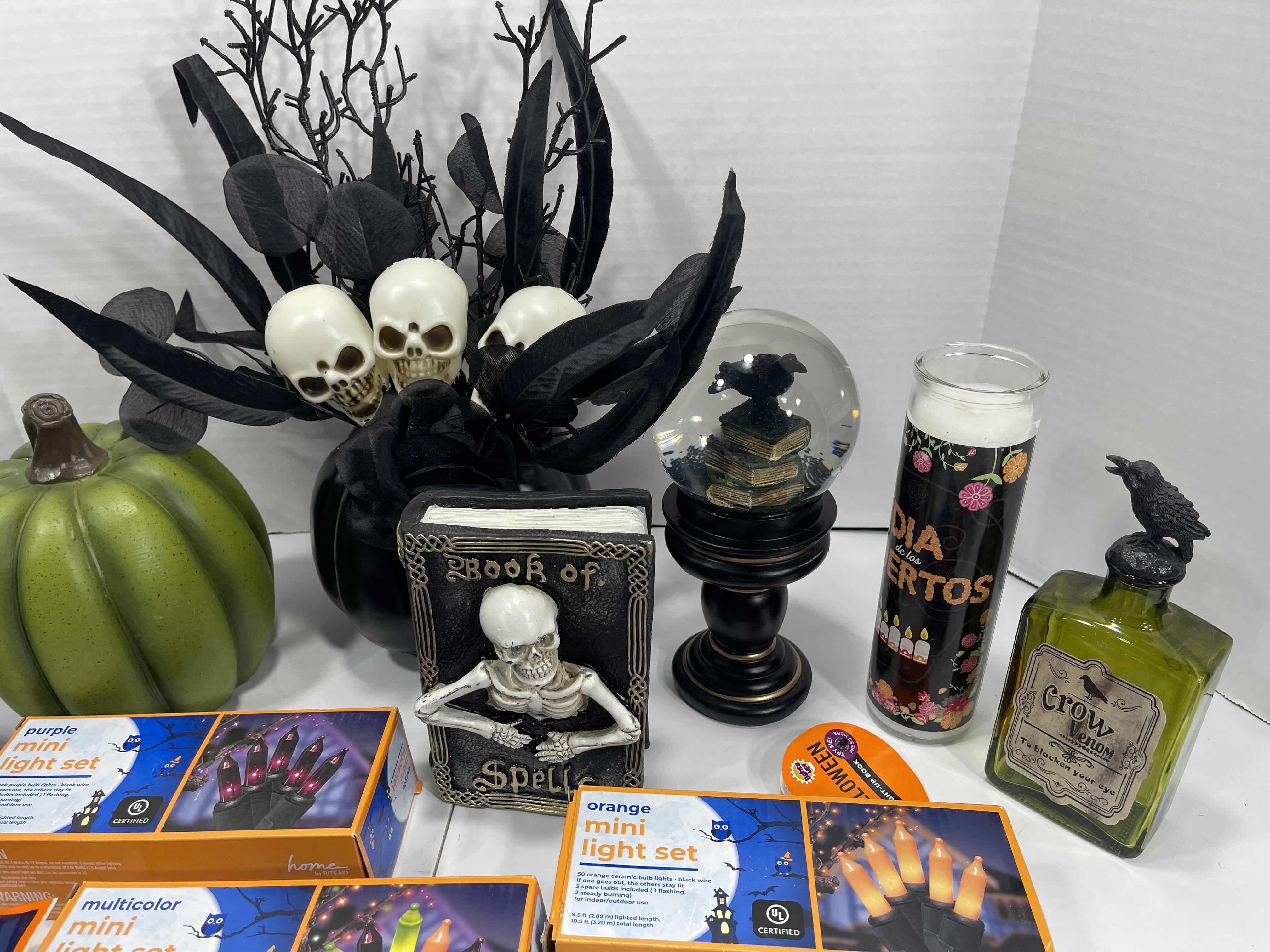 Photo 3 of HALLOWEEN HOME TABLE TOP DECOR (14 ITEMS) -  SPIDER WEBS, LIGHT SETS, GLASS BOTTLE, RAVEN WATER-GLOBE, RESIN DECOR ETC MSRP $100