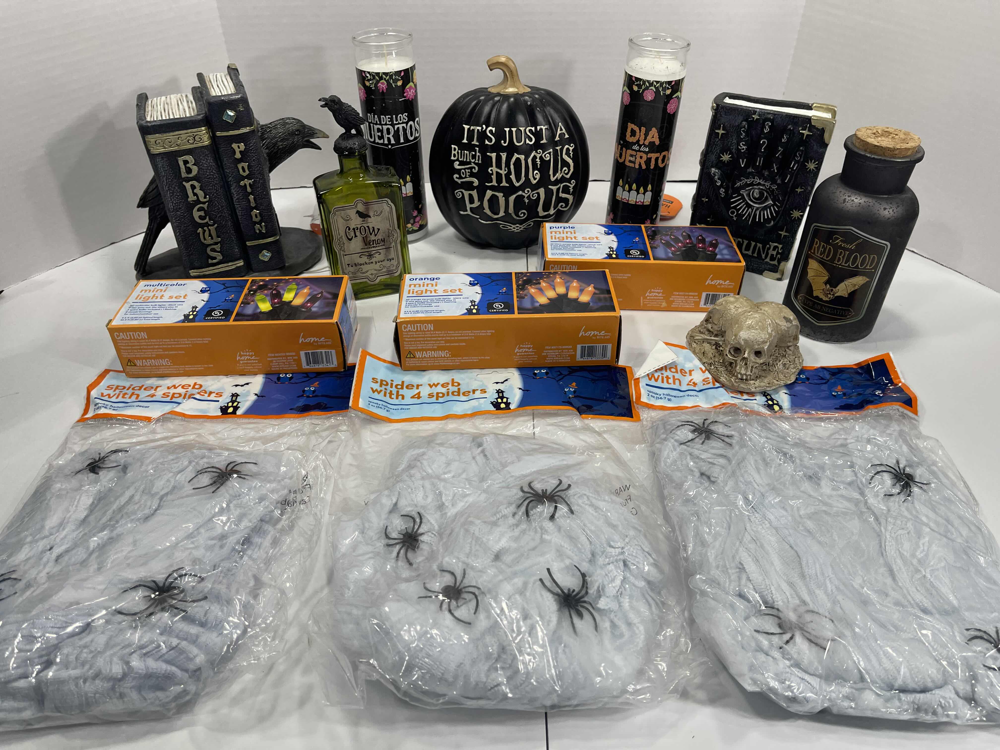 Photo 1 of HALLOWEEN HOME TABLE TOP DECOR (14 ITEMS) -  SPIDER WEBS, LIGHT SETS, CANDLES, RESIN DECOR ETC MSRP $100