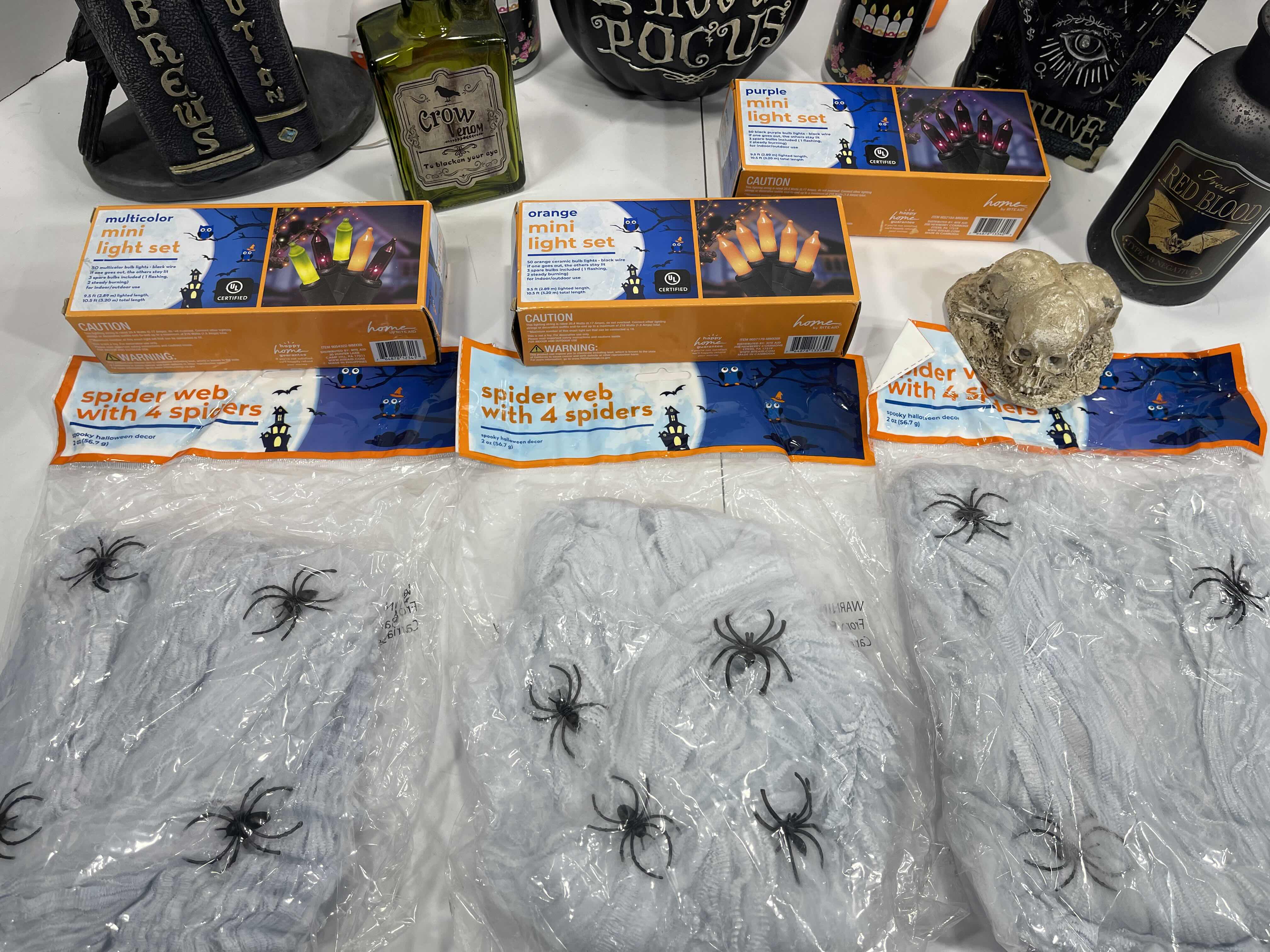 Photo 4 of HALLOWEEN HOME TABLE TOP DECOR (14 ITEMS) -  SPIDER WEBS, LIGHT SETS, CANDLES, RESIN DECOR ETC MSRP $100