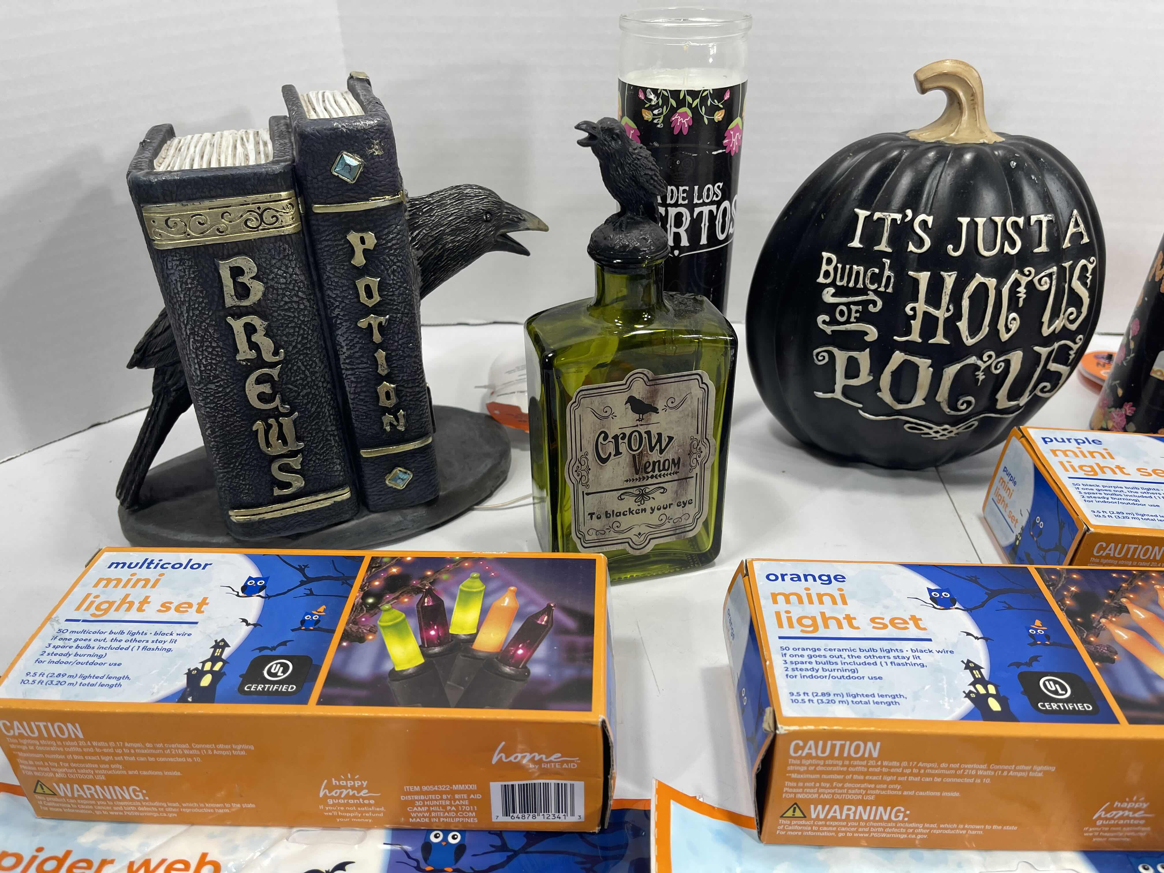 Photo 2 of HALLOWEEN HOME TABLE TOP DECOR (14 ITEMS) -  SPIDER WEBS, LIGHT SETS, CANDLES, RESIN DECOR ETC MSRP $100