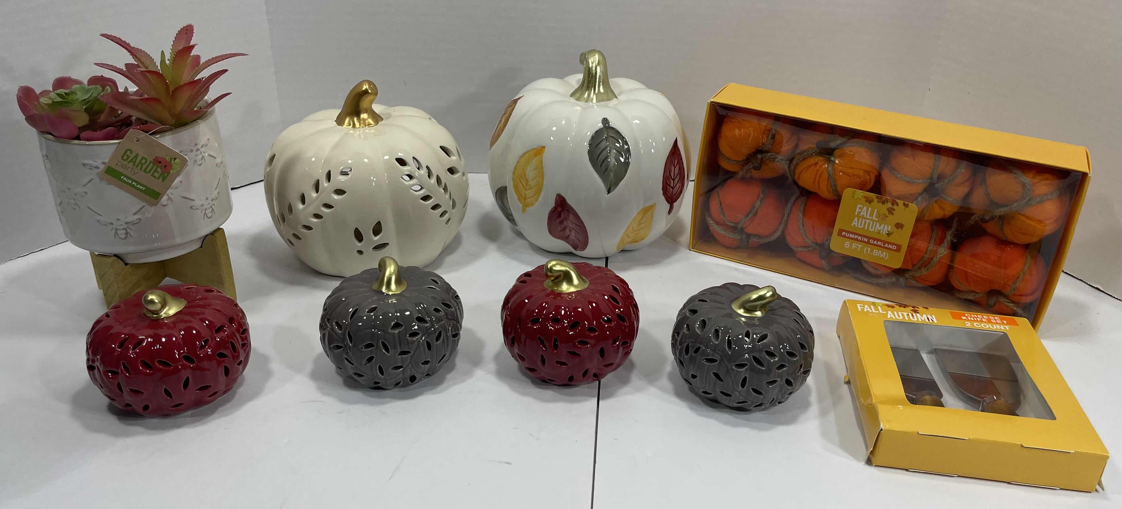 Photo 1 of HOLIDAY CERAMIC PUMPKINS (6) TALLEST 6.5”, GARDEN PARTY FAUX PLANT H8” & AUTUMN FALL HOME DECOR - PUMPKIN GARLAND AND CHEESE KNIFE SET MSRP $90