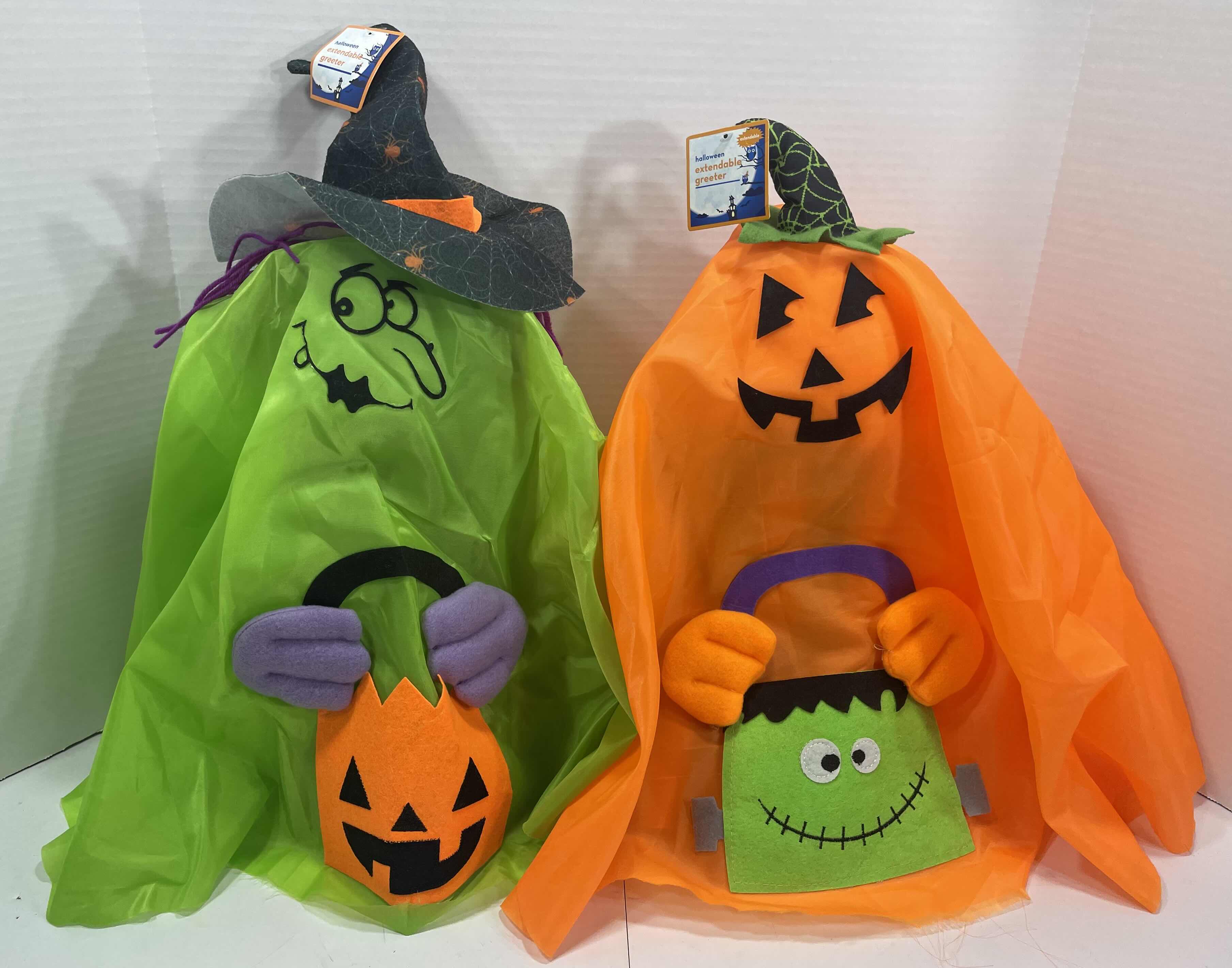 Photo 1 of HALLOWEEN EXTENDABLE GREETERS (2) - PUMPKIN (EXTENDED H28”) & WITCH (EXTENDED H30”) MSRP $50