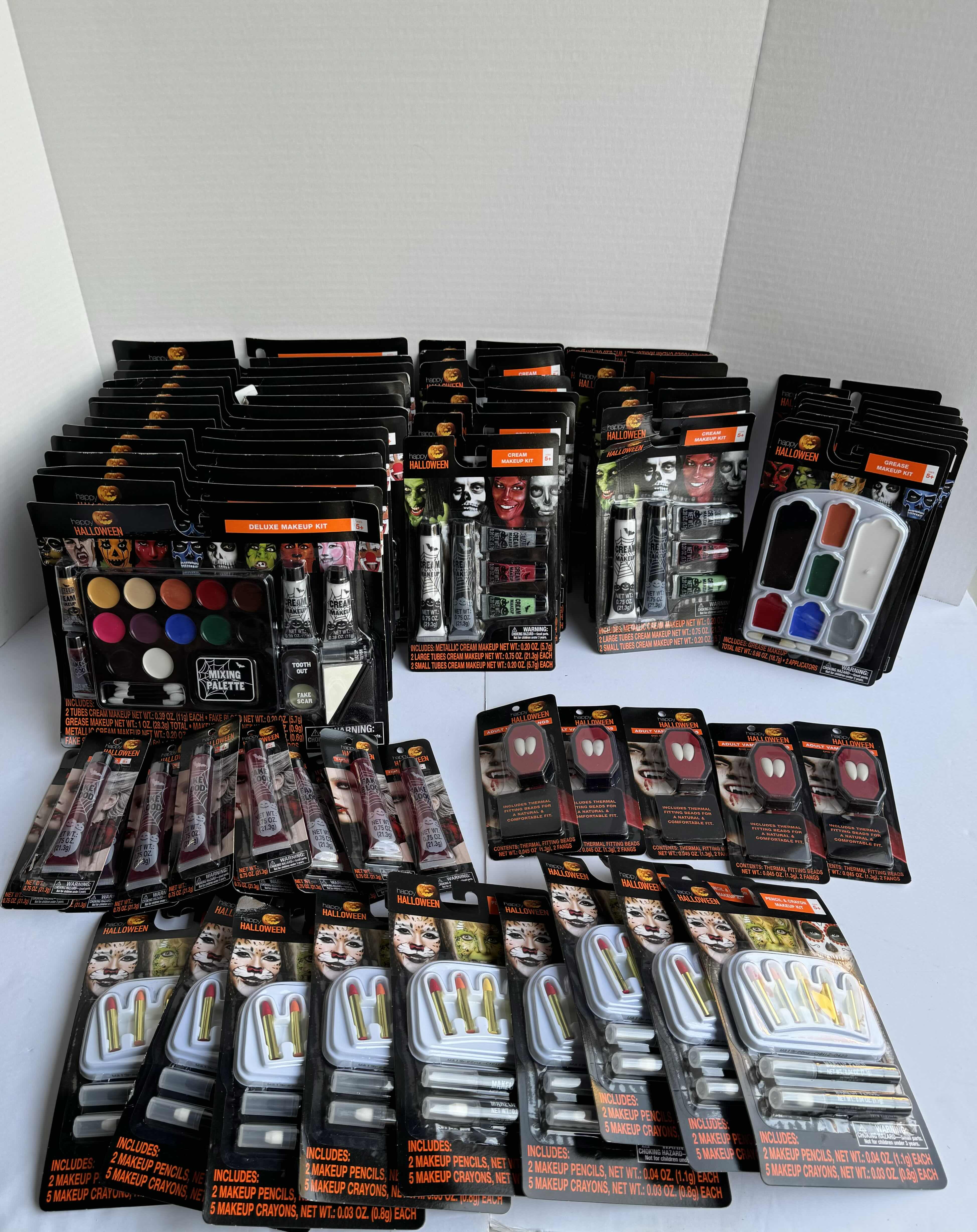 Photo 1 of HAPPY HALLOWEEN LARGE ASSORTMENT MAKE UP KITS FANGS & FAKE BLOOD & MORE (65 PIECES)