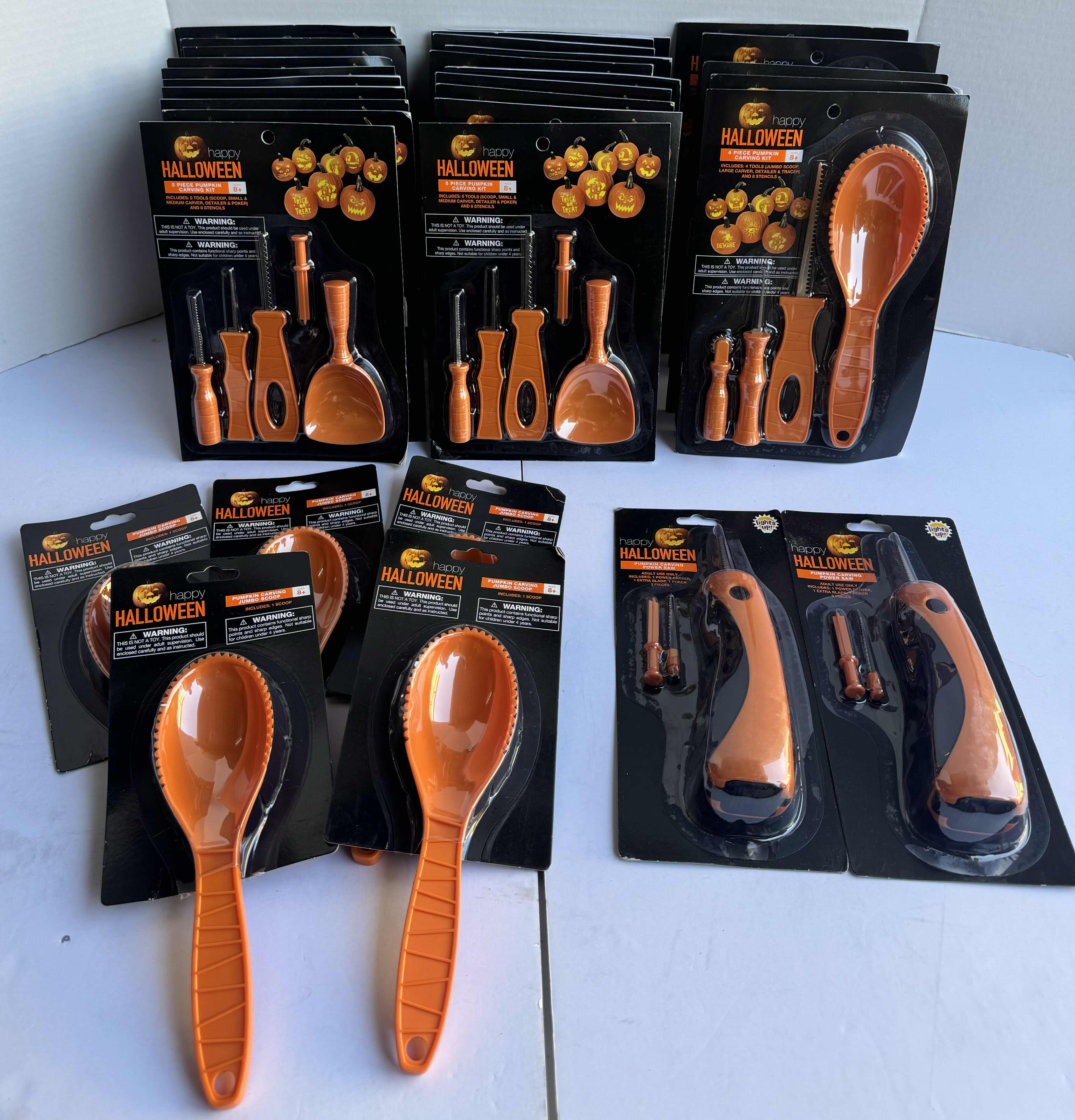 Photo 1 of HAPPY HALLOWEEN LARGE RANDOM ASSORTMENT OF PUMPKIN CARVING KITS WITH STENCILS, SCOOPS & POWER SAWS, (32 TOTAL PIECES) MSRP $200