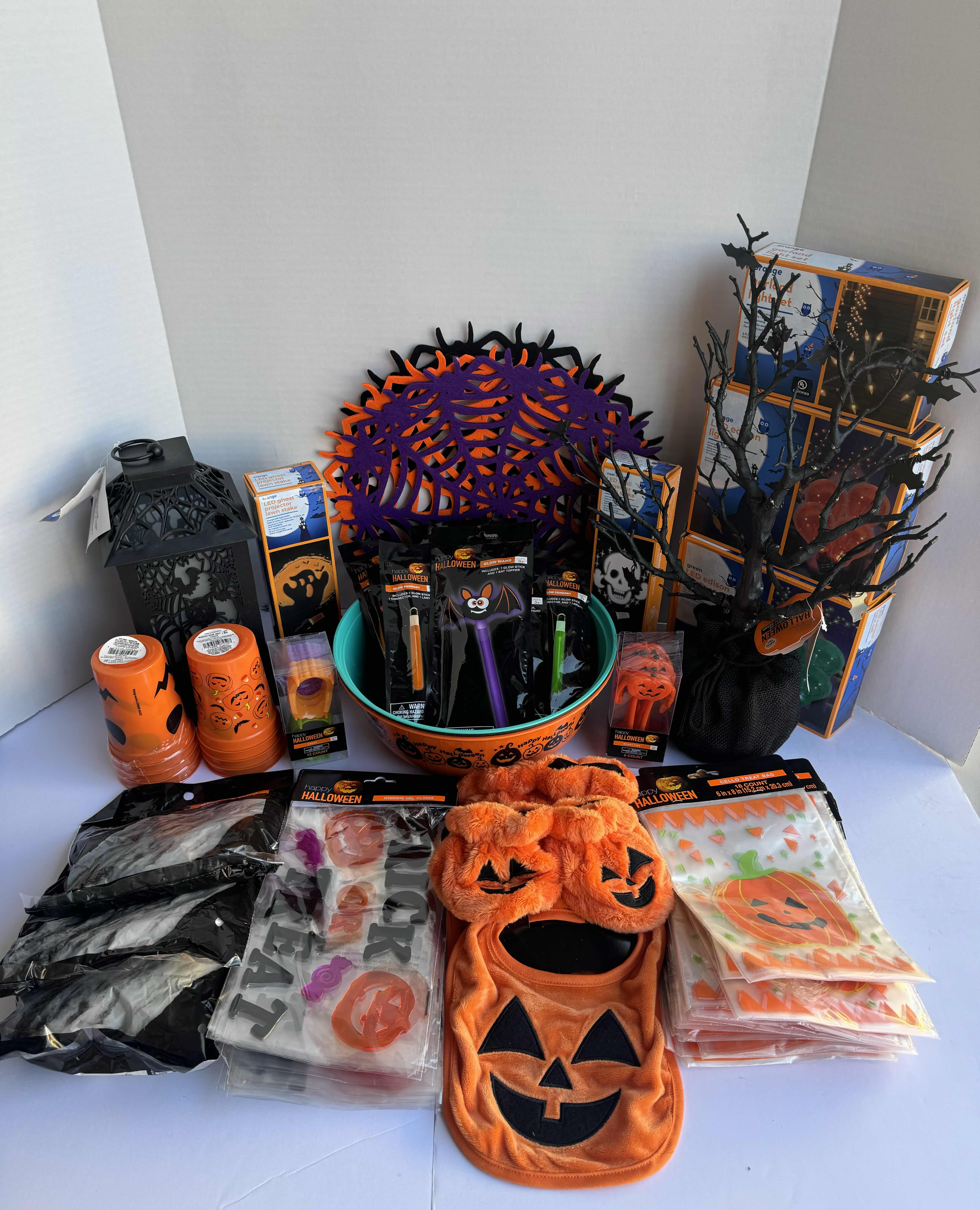 Photo 1 of HALLOWEEN TABLE TOP DECOR LARGE ASSORTMENT - CANDY BOWLS, LIGHT SETS, GLOW STICKS, HALLOWEEN CUPS, AND MORE MSRP $70