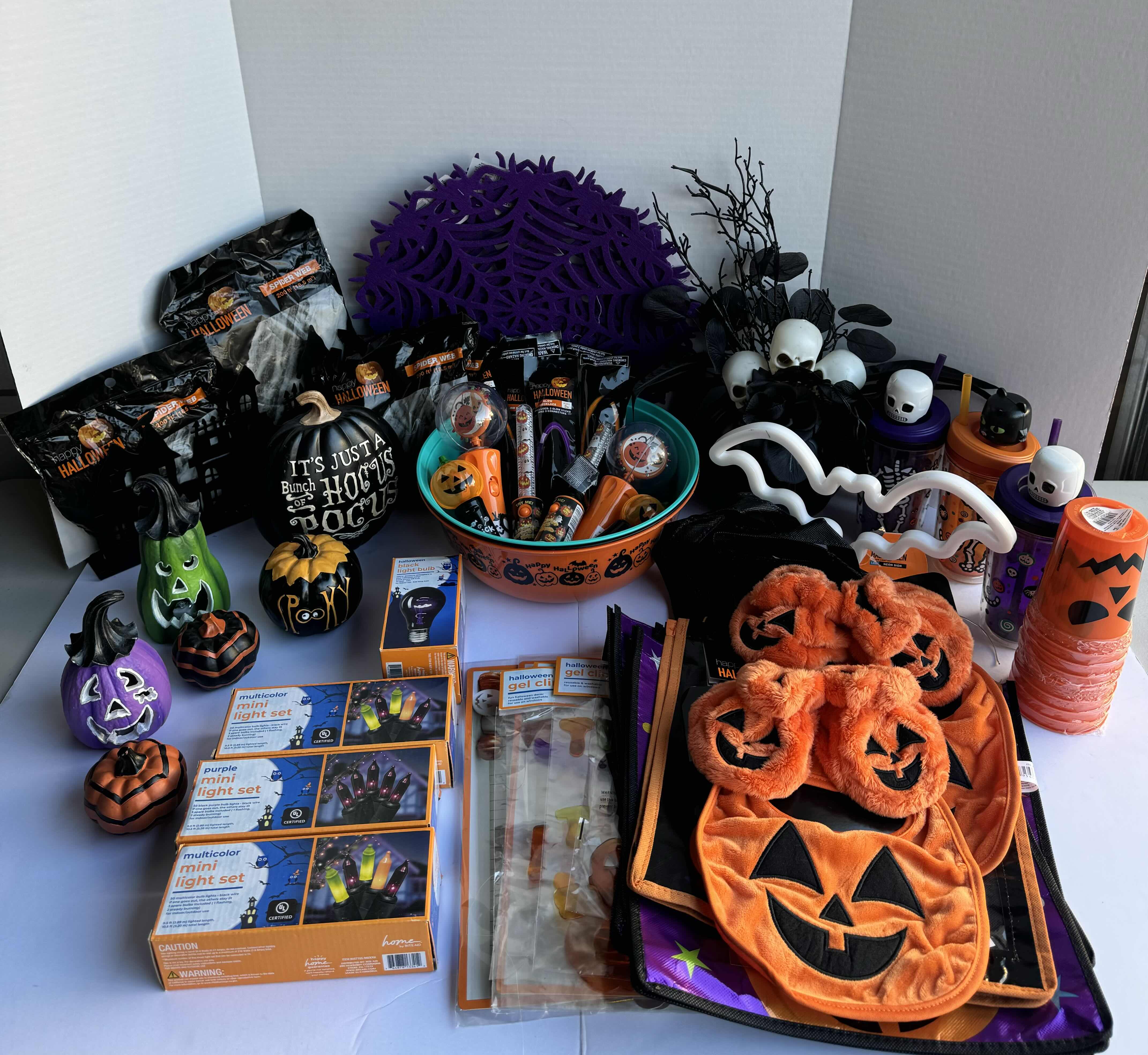 Photo 1 of HALLOWEEN TABLE TOP DECOR LARGE ASSORTMENT - CANDY BOWLS, LIGHT SETS, GLOW STICKS, HALLOWEEN CUPS, WOOD DISPLAYS, RESIN PUMPKINS, TOYS AND MORE MSRP $70