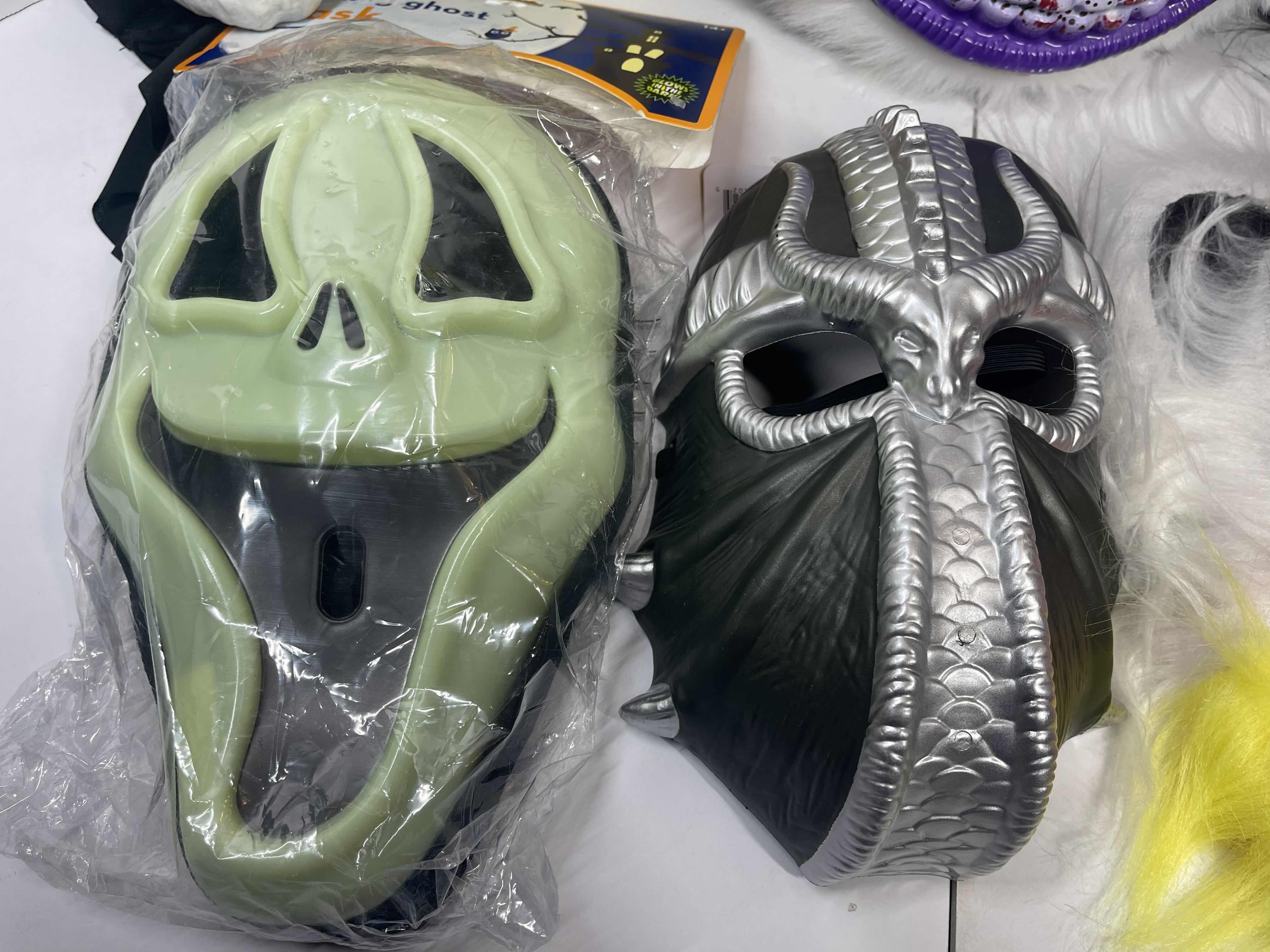 Photo 3 of HALLOWEEN PLASTIC MASKS (8) ONE SIZE FITS MOST ADULTS