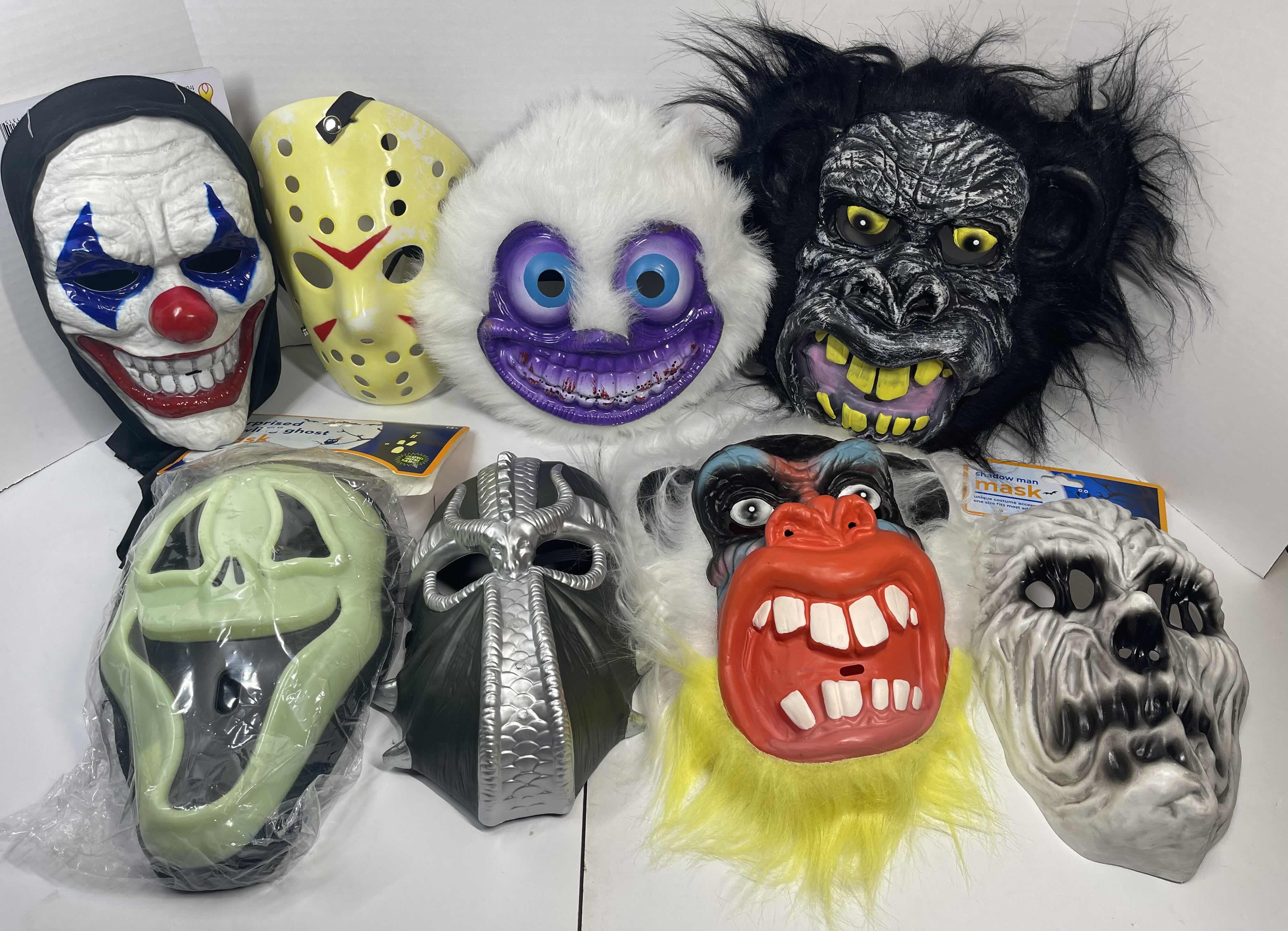 Photo 1 of HALLOWEEN PLASTIC MASKS (8) ONE SIZE FITS MOST ADULTS