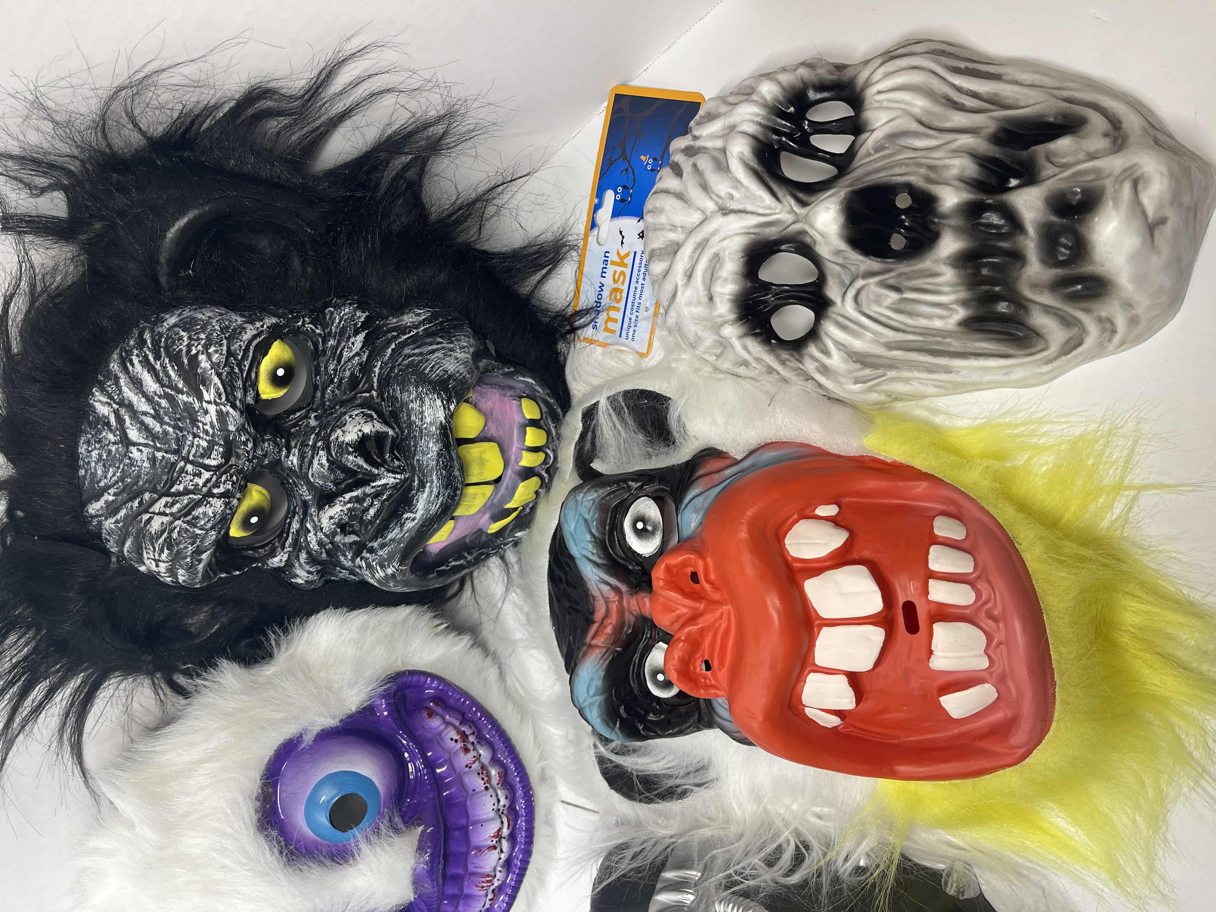 Photo 5 of HALLOWEEN PLASTIC MASKS (8) ONE SIZE FITS MOST ADULTS