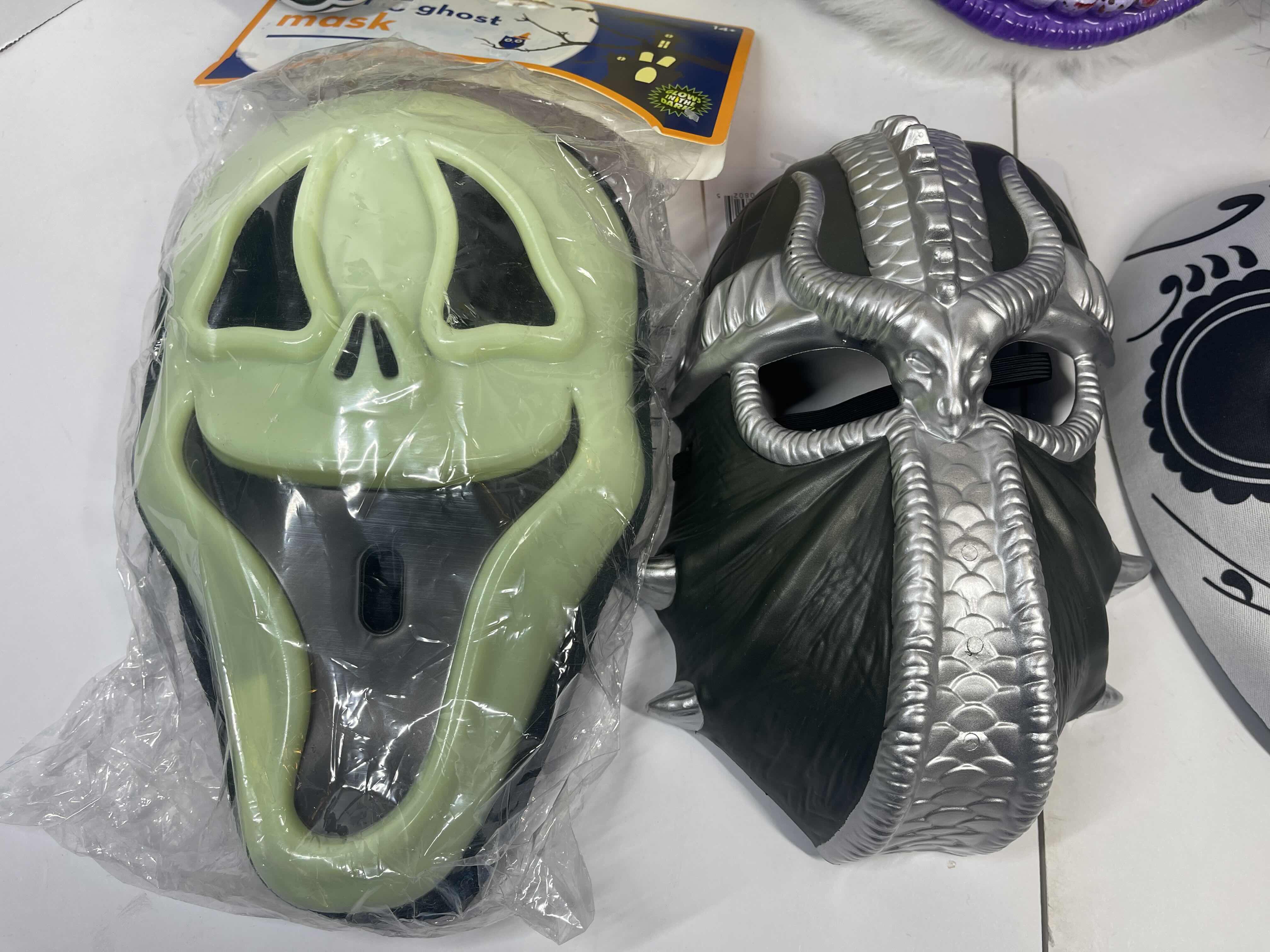 Photo 3 of HALLOWEEN PLASTIC MASKS (8) ONE SIZE FITS MOST ADULTS