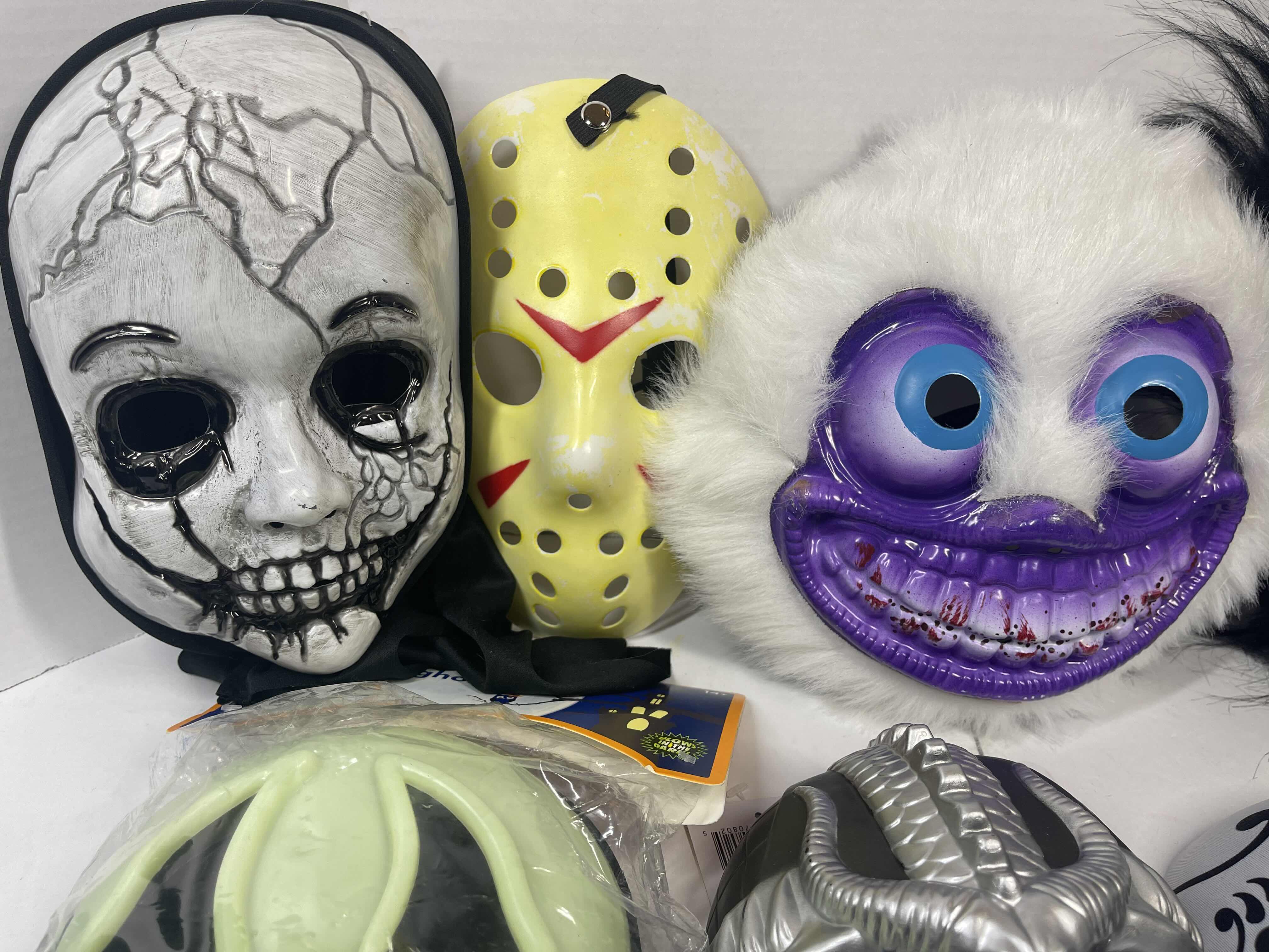 Photo 2 of HALLOWEEN PLASTIC MASKS (8) ONE SIZE FITS MOST ADULTS