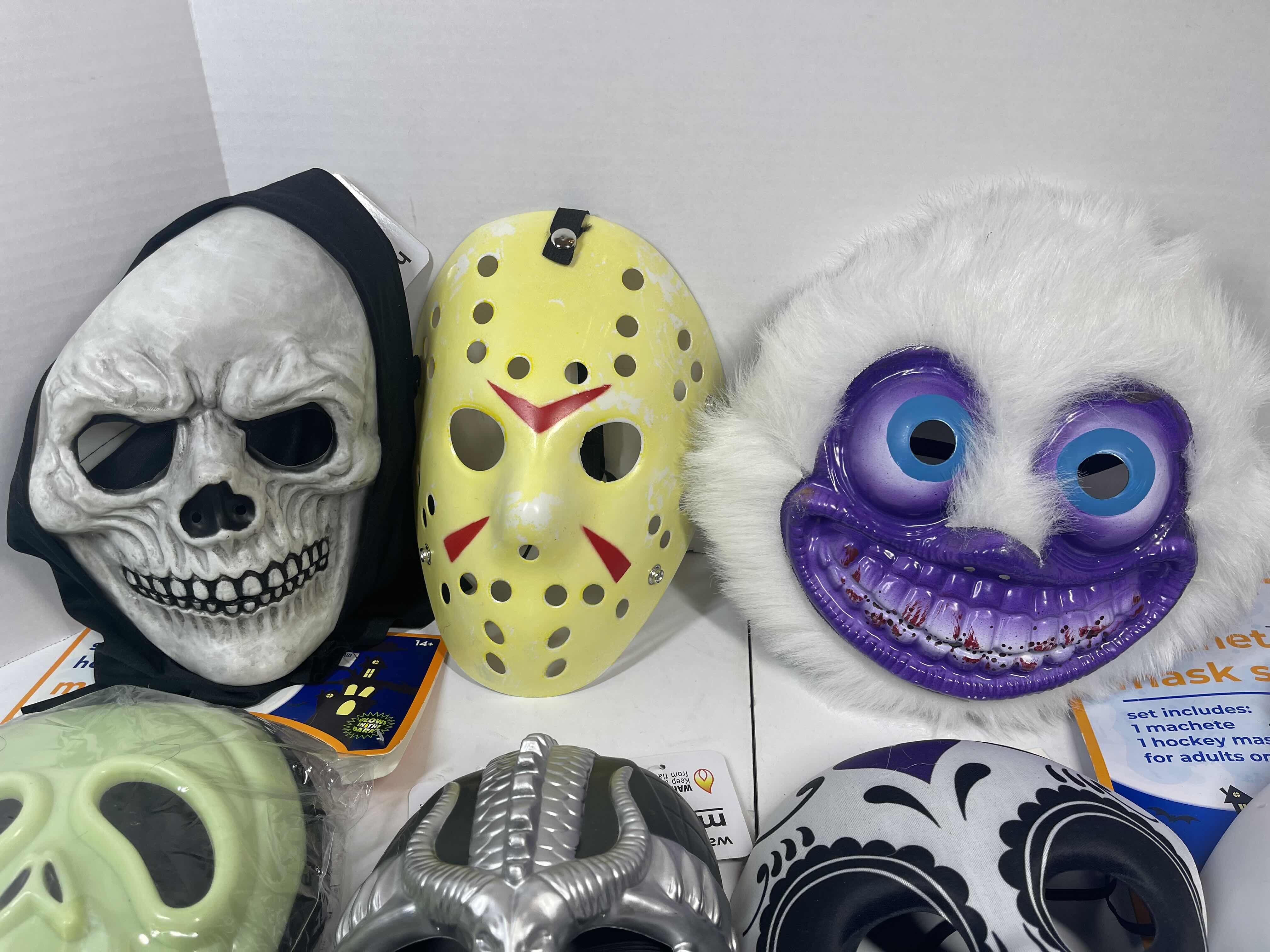 Photo 2 of HALLOWEEN PLASTIC MASKS (7) ONE SIZE FITS MOST ADULTS