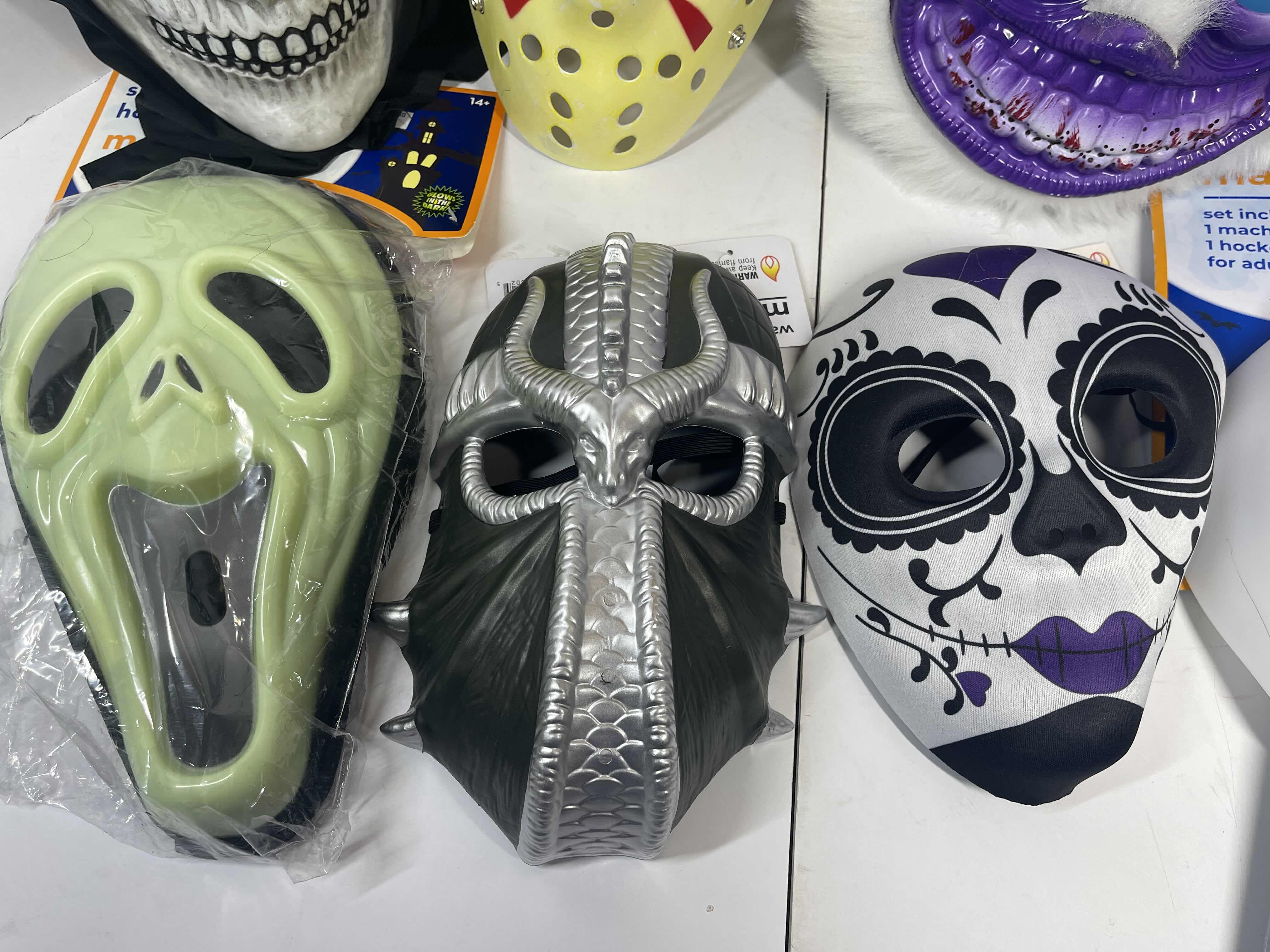 Photo 3 of HALLOWEEN PLASTIC MASKS (7) ONE SIZE FITS MOST ADULTS