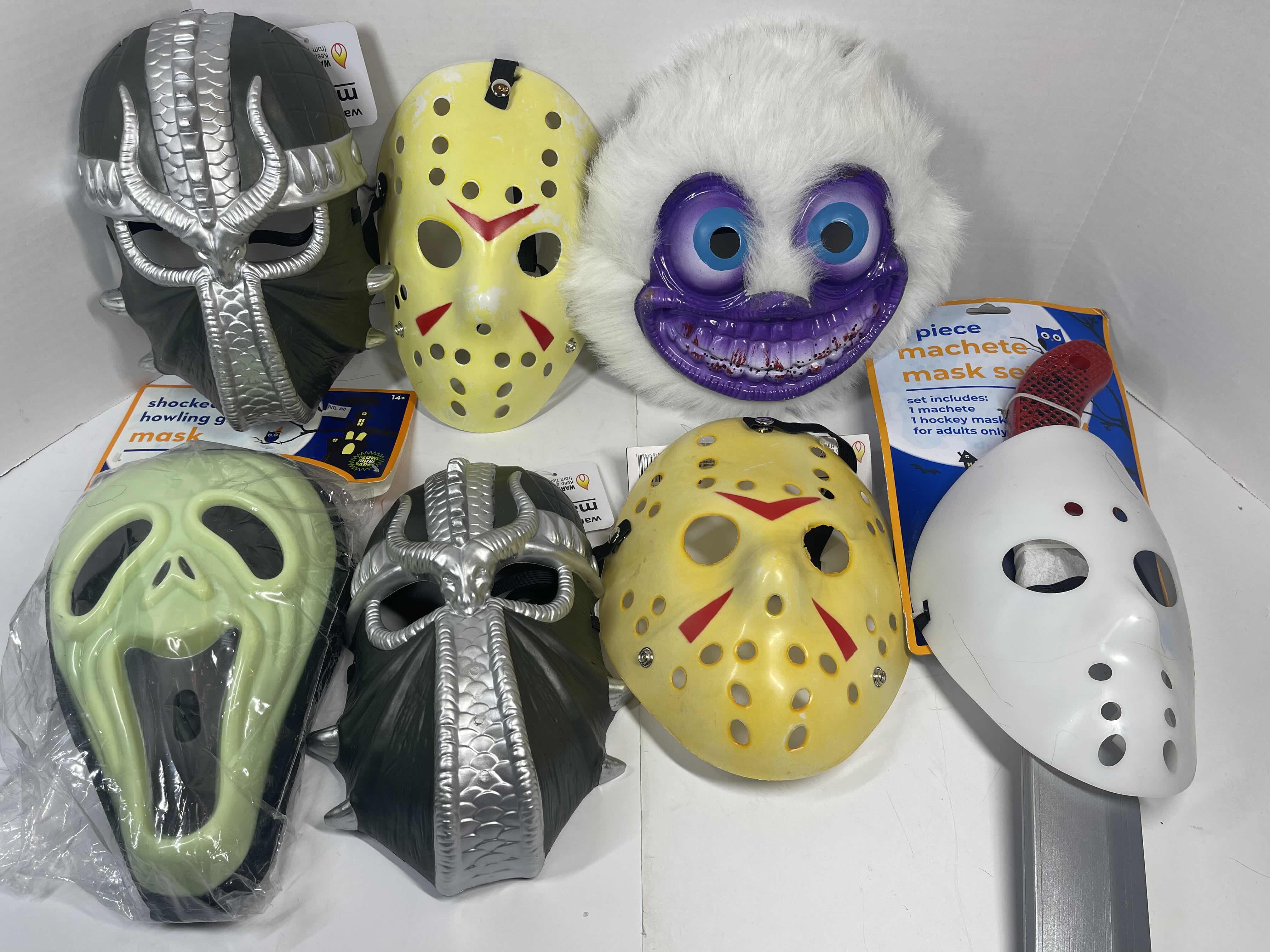 Photo 1 of HALLOWEEN PLASTIC MASKS (7) ONE SIZE FITS MOST ADULTS